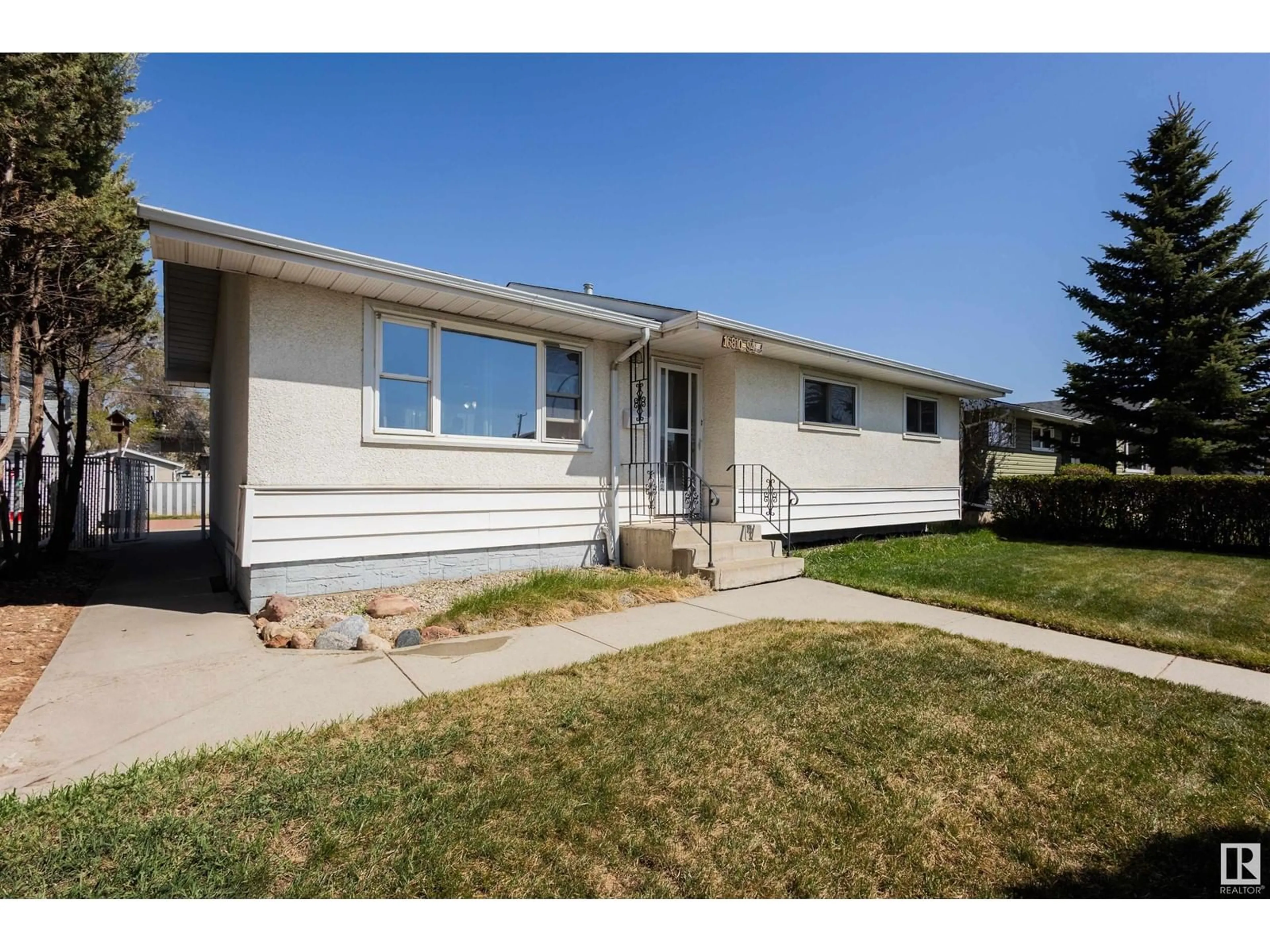Home with vinyl exterior material, street for 16810 94 AV, Edmonton Alberta T5R5L5