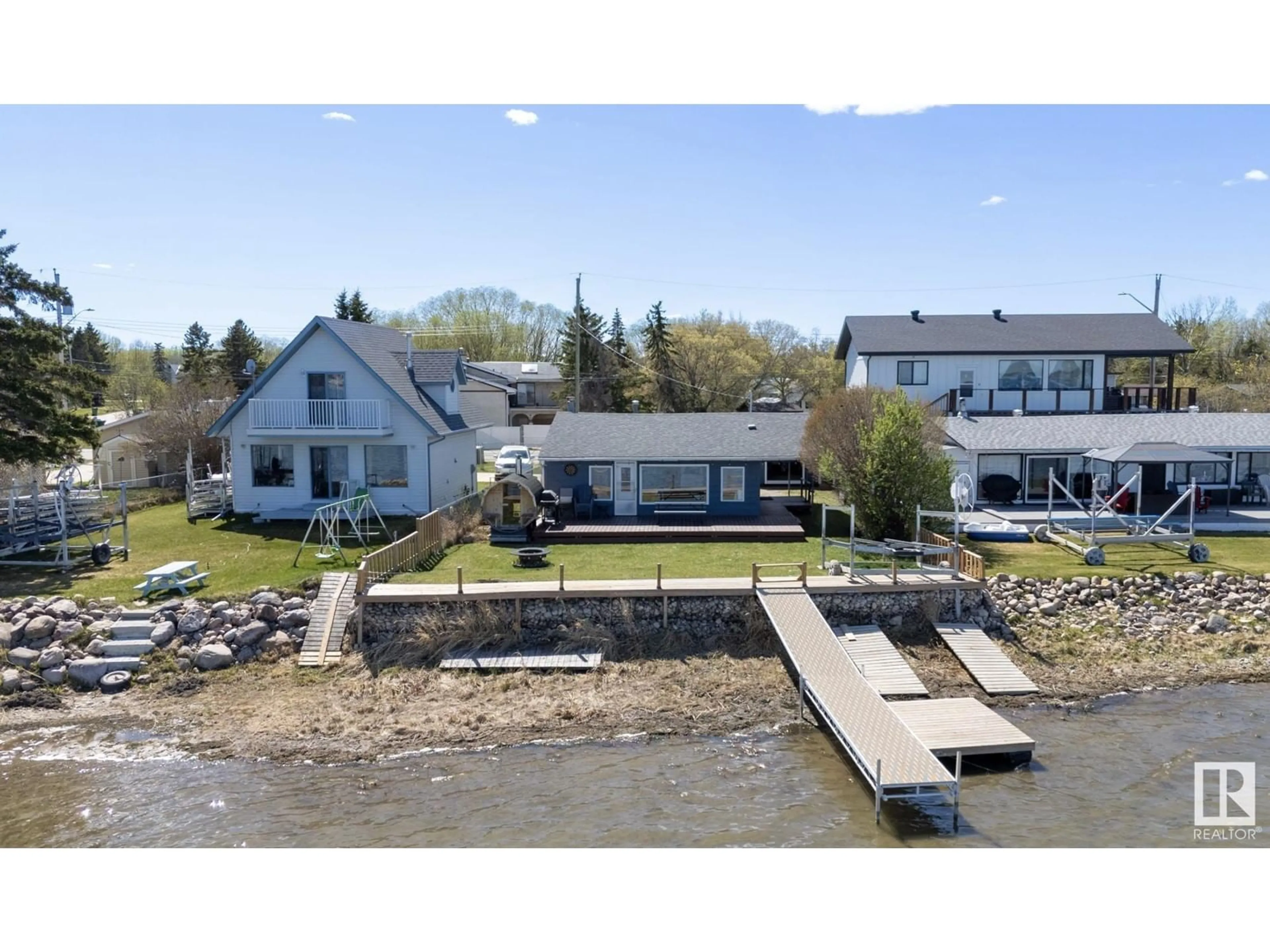 A pic from outside/outdoor area/front of a property/back of a property/a pic from drone, water/lake/river/ocean view for 6330 STE ANNE TRAIL, Rural Lac Ste. Anne County Alberta T0E0A0