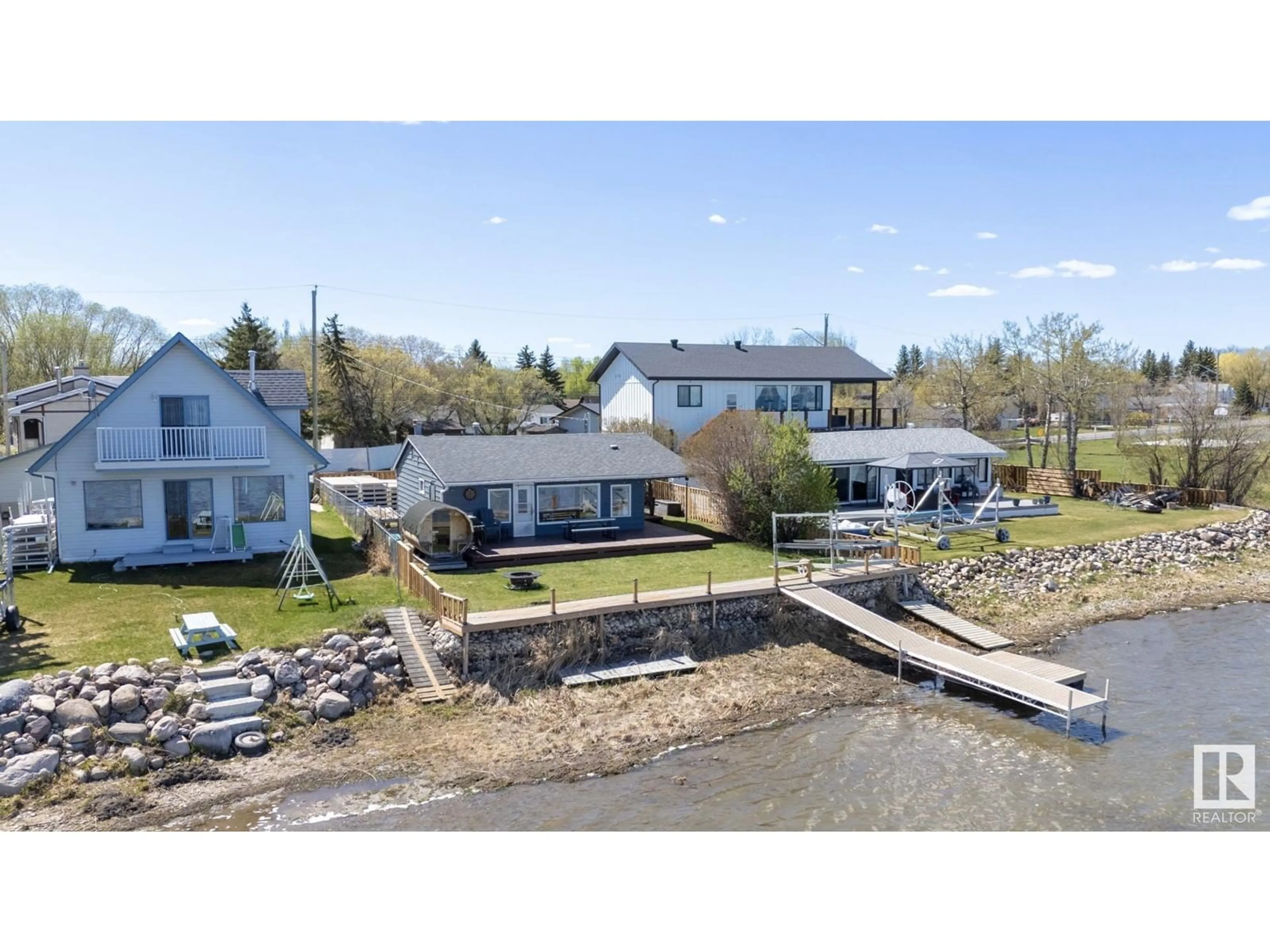 A pic from outside/outdoor area/front of a property/back of a property/a pic from drone, water/lake/river/ocean view for 6330 STE ANNE TRAIL, Rural Lac Ste. Anne County Alberta T0E0A0