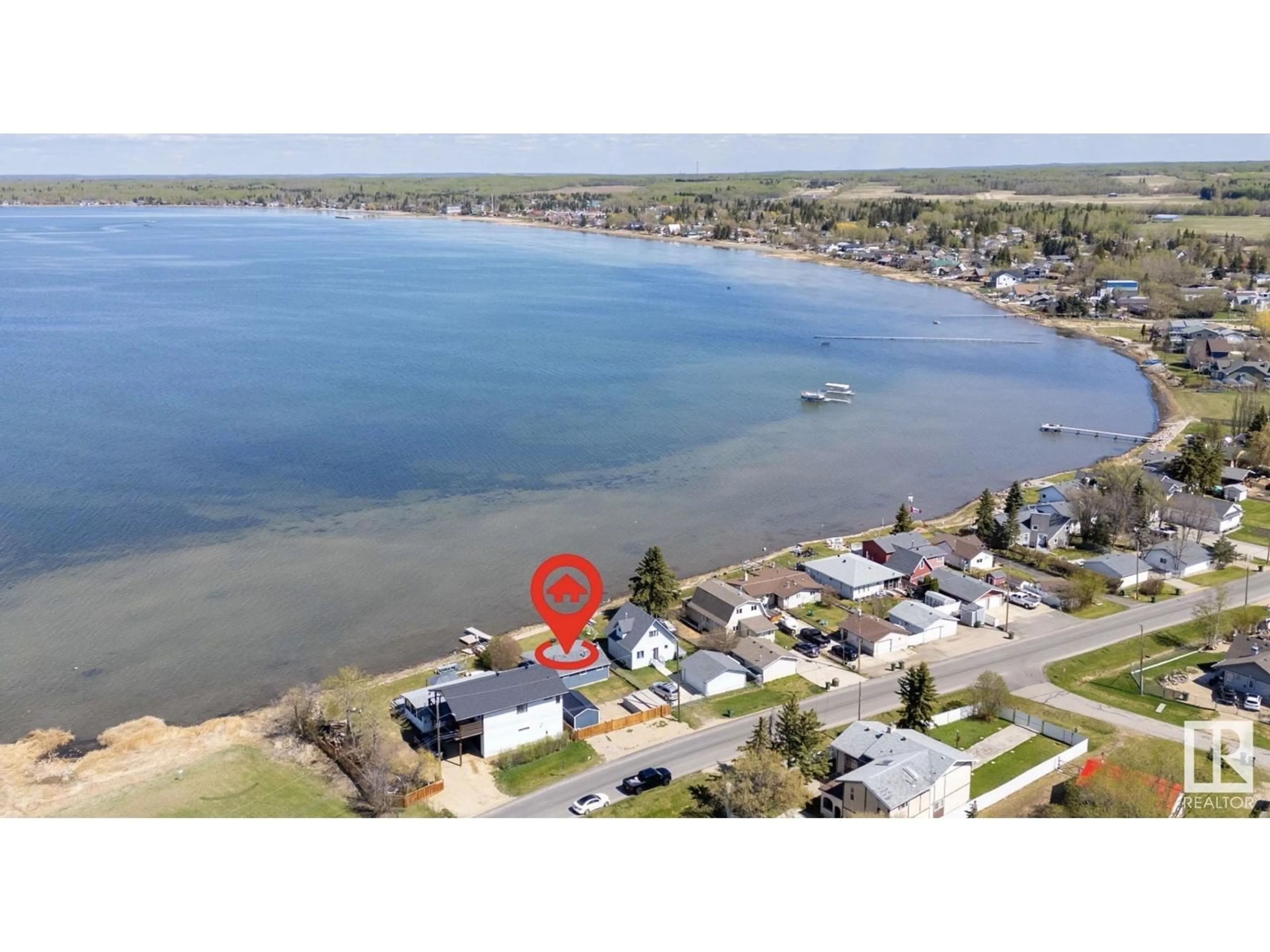 A pic from outside/outdoor area/front of a property/back of a property/a pic from drone, water/lake/river/ocean view for 6330 STE ANNE TRAIL, Rural Lac Ste. Anne County Alberta T0E0A0