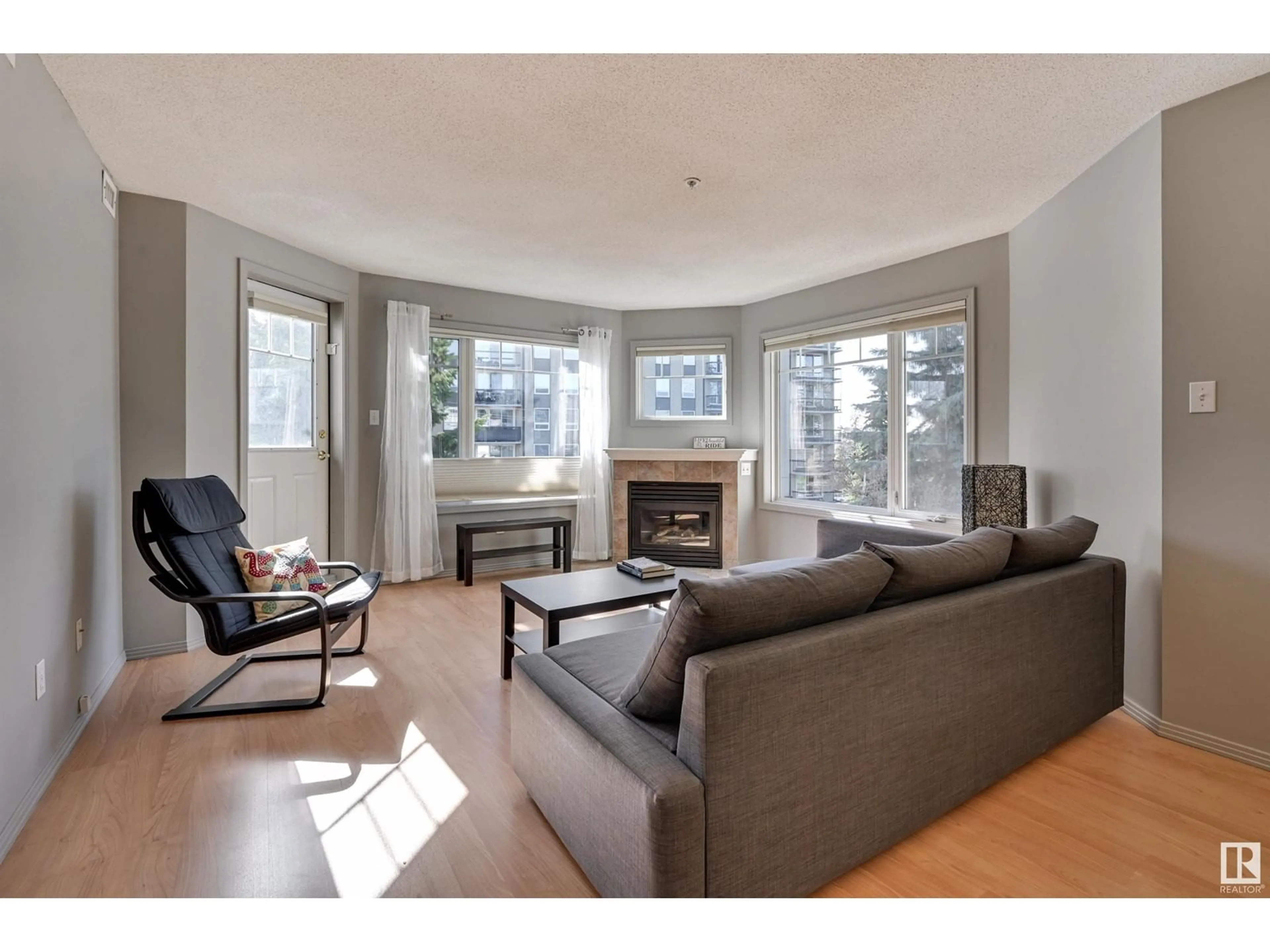 Living room with furniture, wood/laminate floor for #305 - 8909 100 ST, Edmonton Alberta T6E6T4
