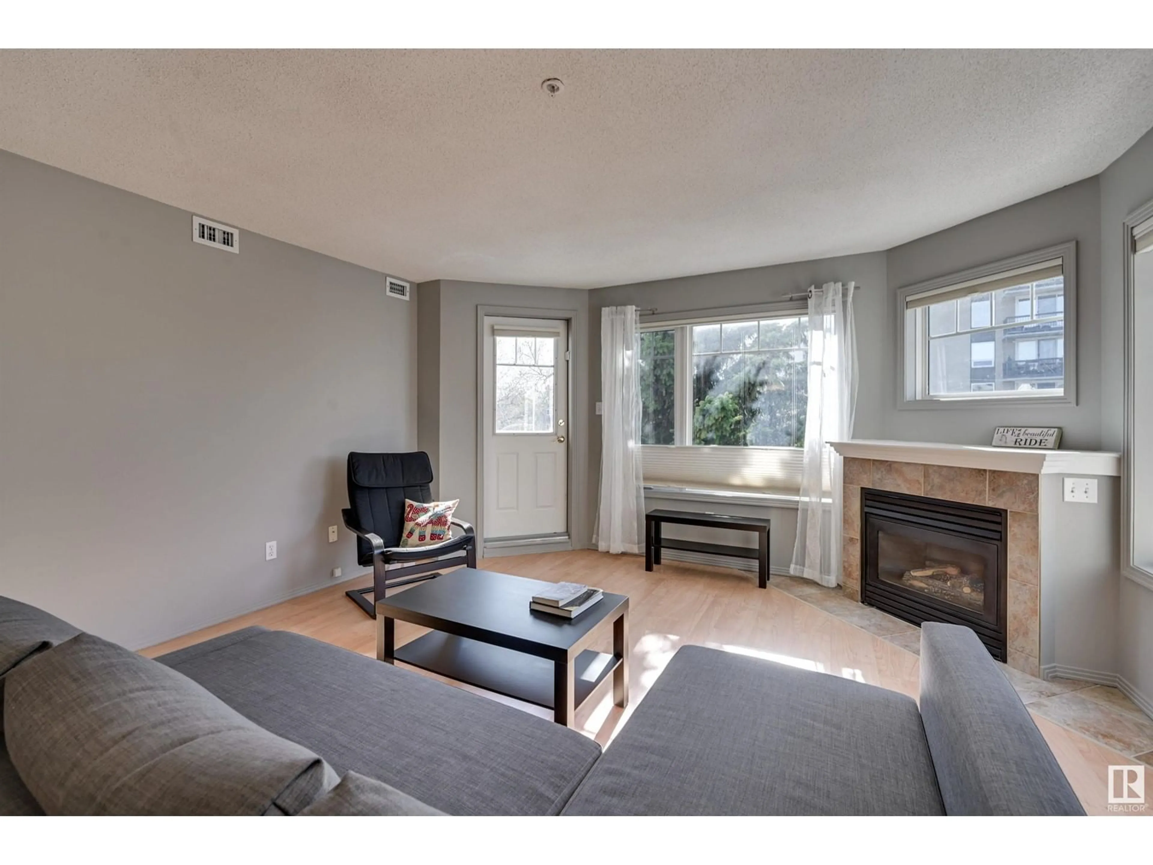 Living room with furniture, wood/laminate floor for #305 - 8909 100 ST, Edmonton Alberta T6E6T4