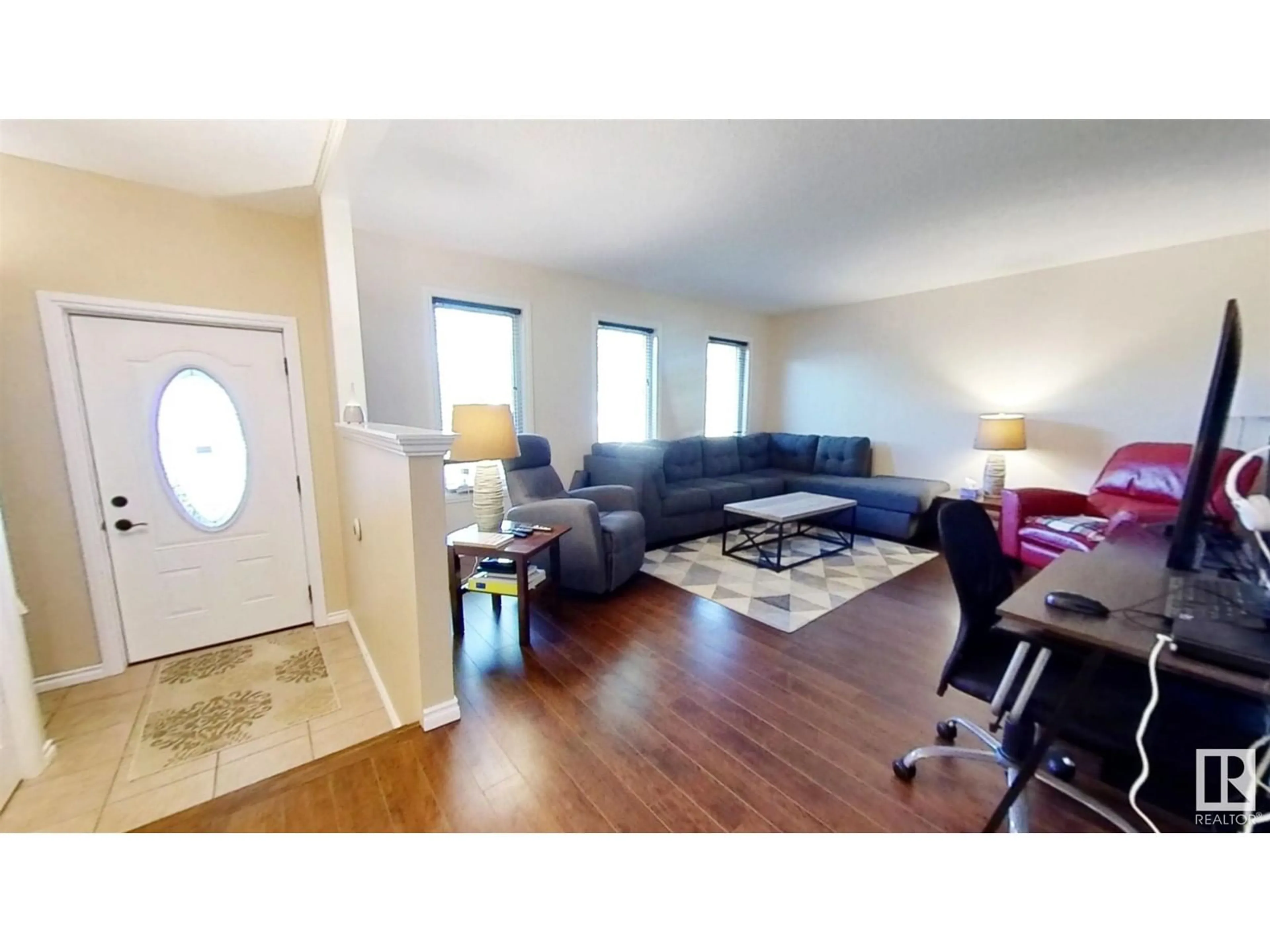 Living room with furniture, wood/laminate floor for 4104 40 AV, Bonnyville Town Alberta T9N1T9