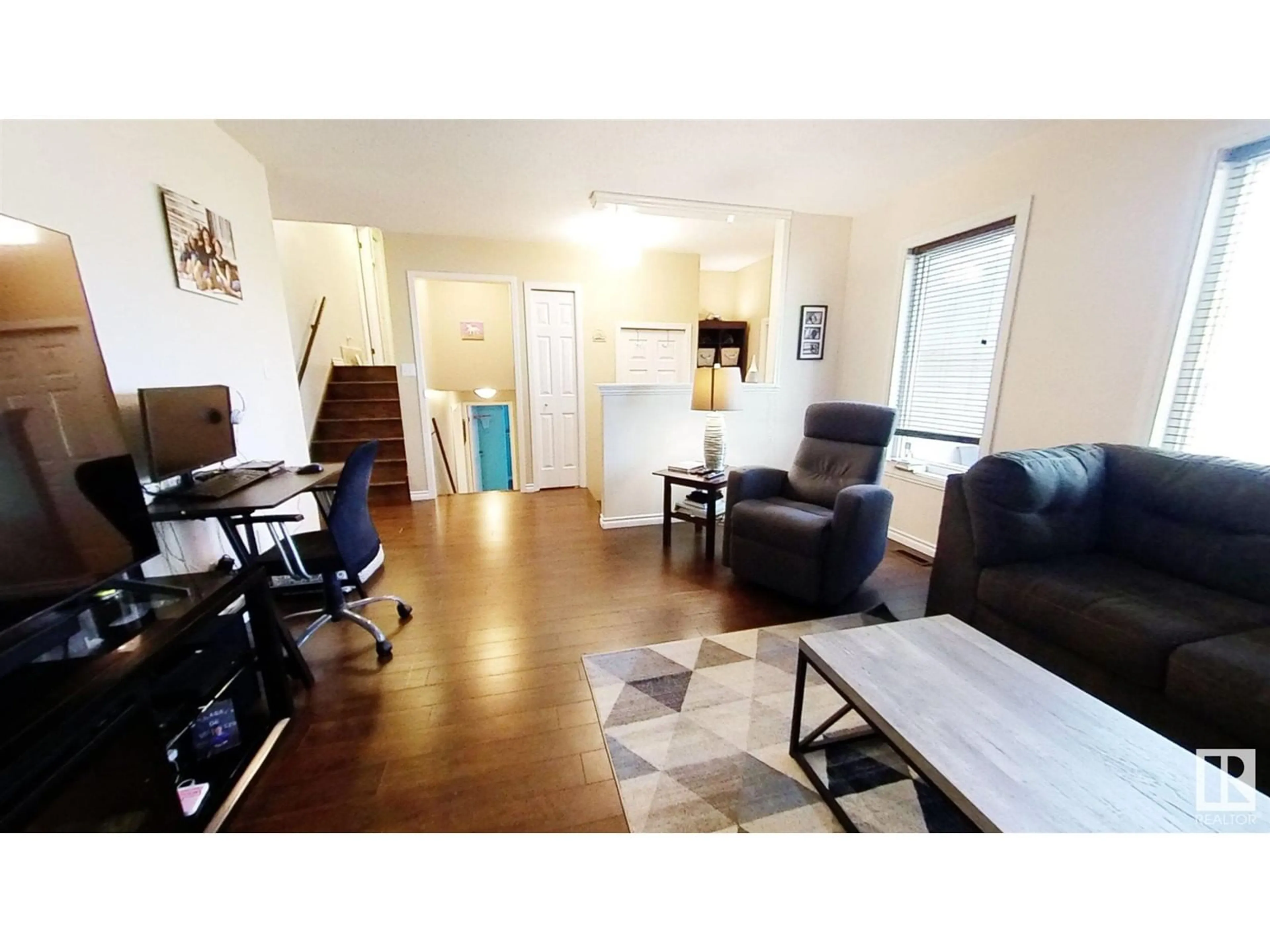 Living room with furniture, wood/laminate floor for 4104 40 AV, Bonnyville Town Alberta T9N1T9