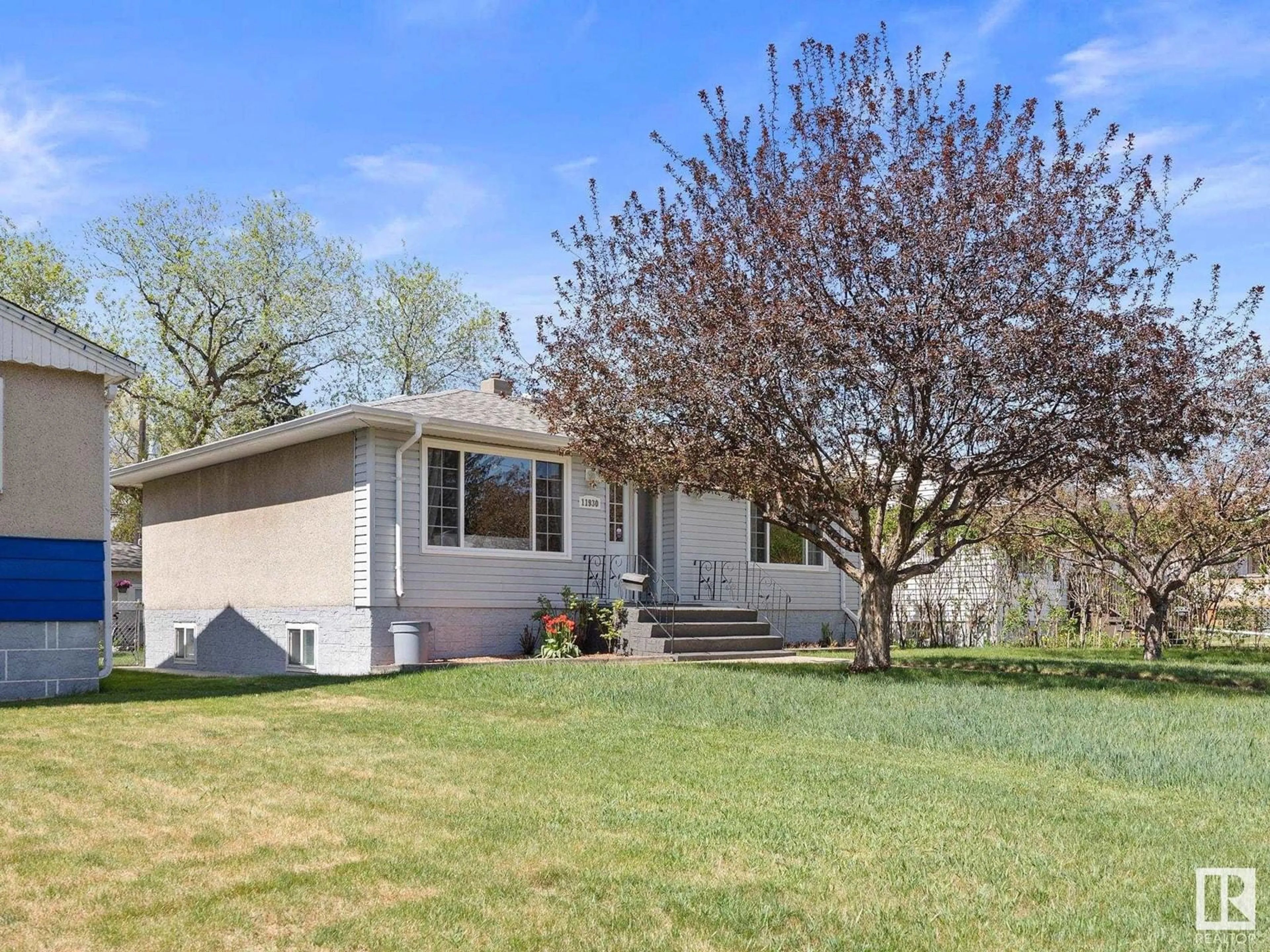 Home with vinyl exterior material, street for NW - 11930 50 ST, Edmonton Alberta T5W3C2