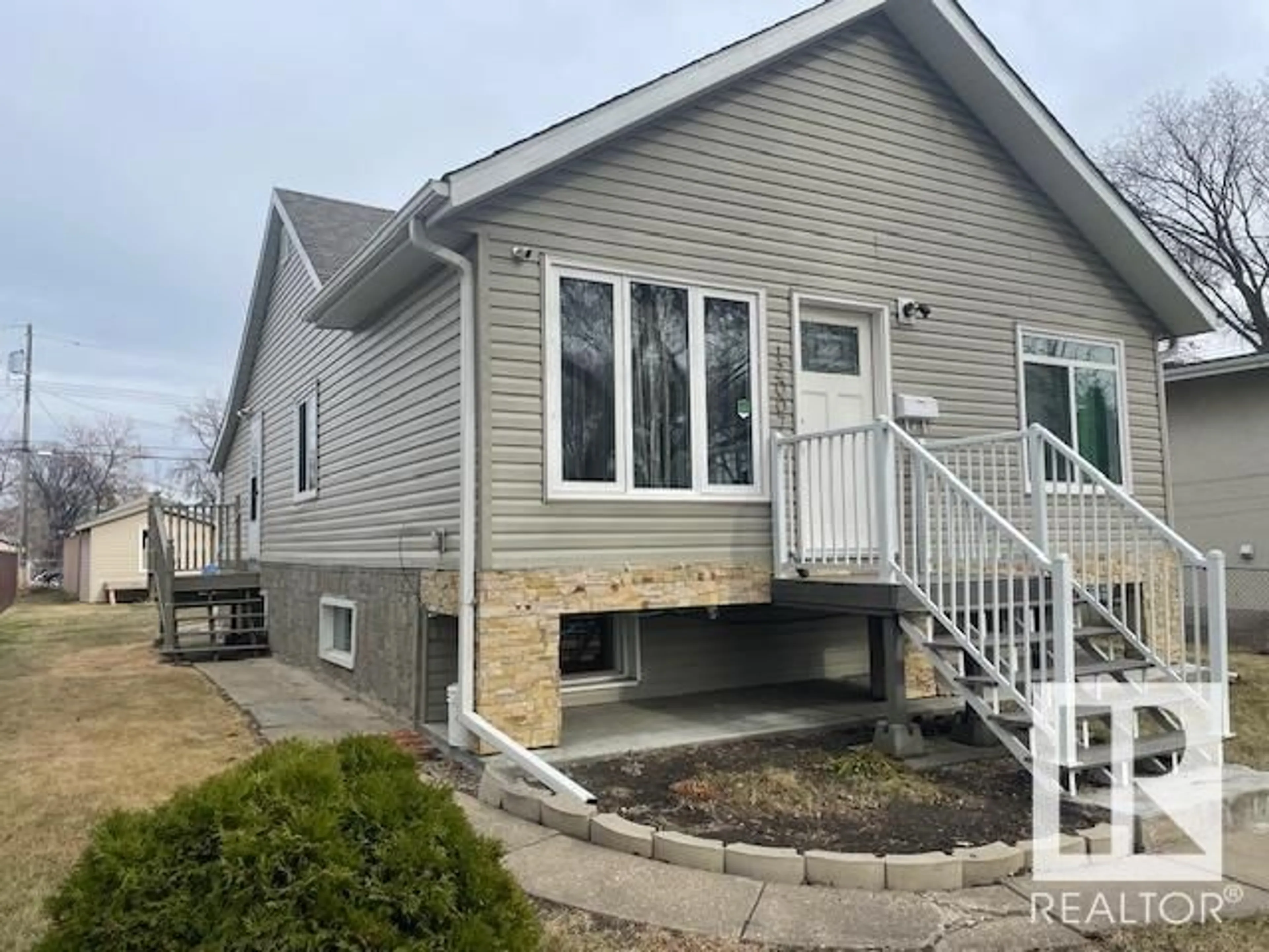 Home with vinyl exterior material, street for 12007 87 ST, Edmonton Alberta T5B3N4