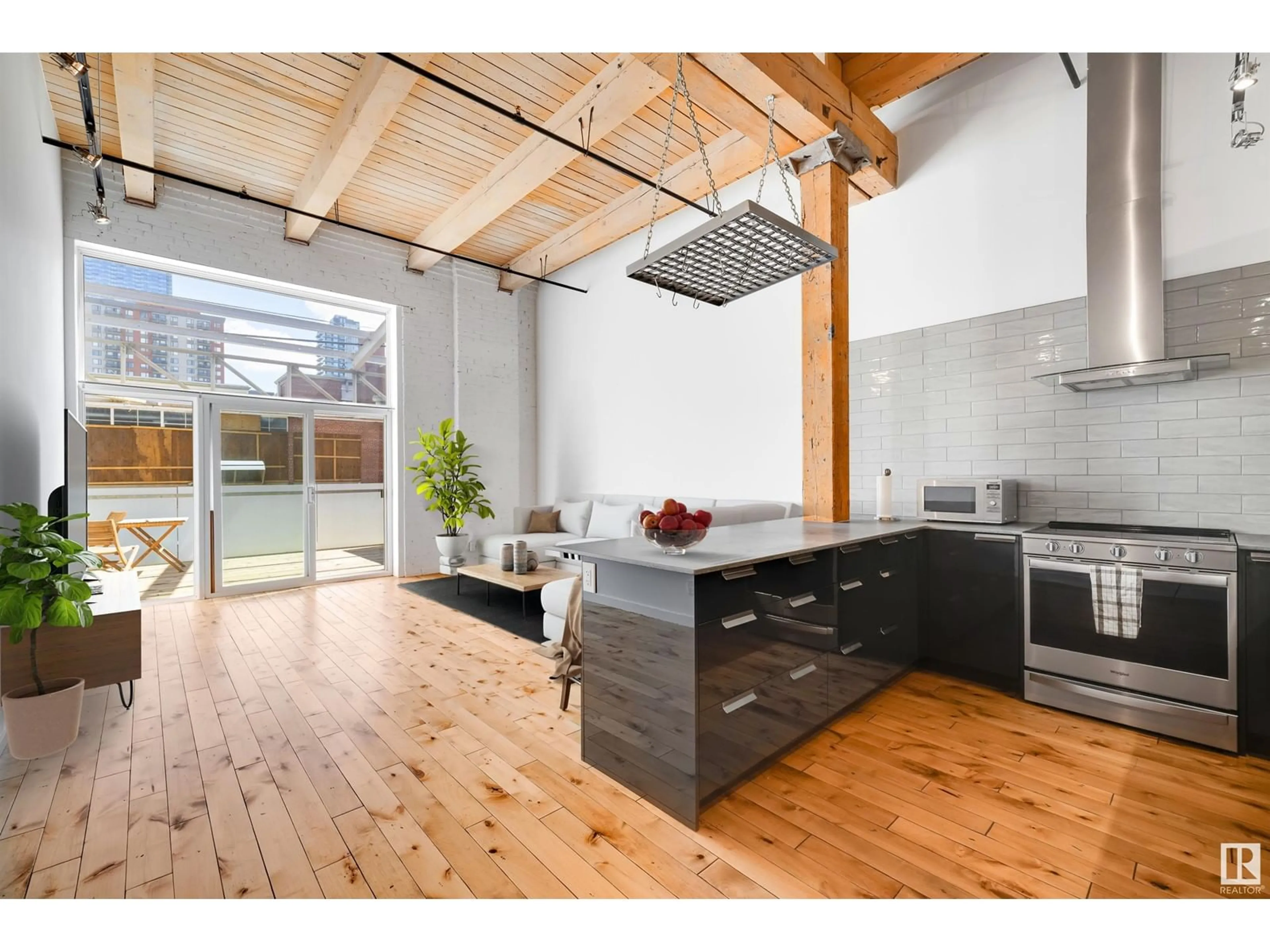 Open concept kitchen, wood/laminate floor for #104 - 10309 107 ST, Edmonton Alberta T5J1K3