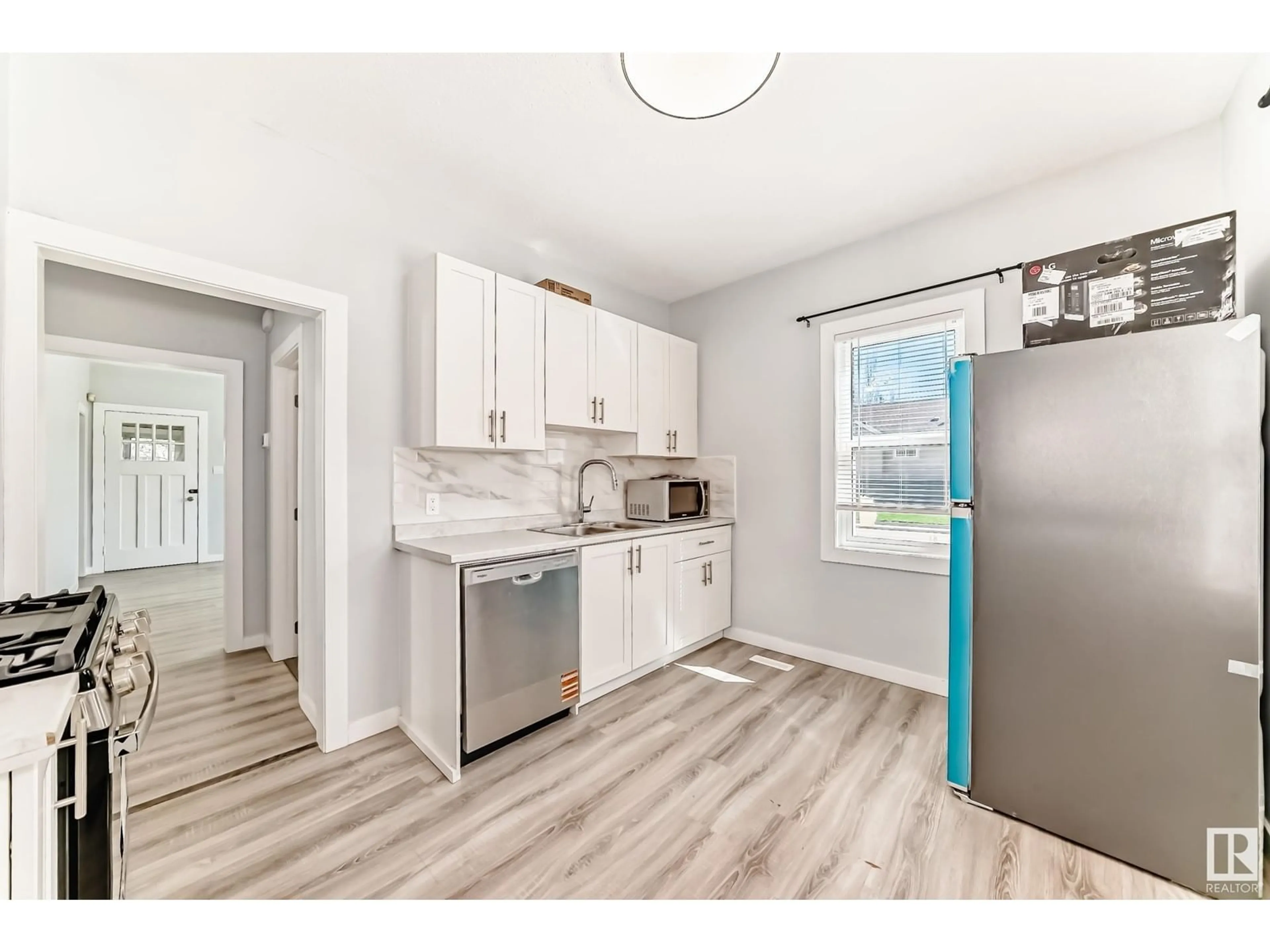 Open concept kitchen, unknown for NW - 11902 90 ST, Edmonton Alberta T5B3Y9