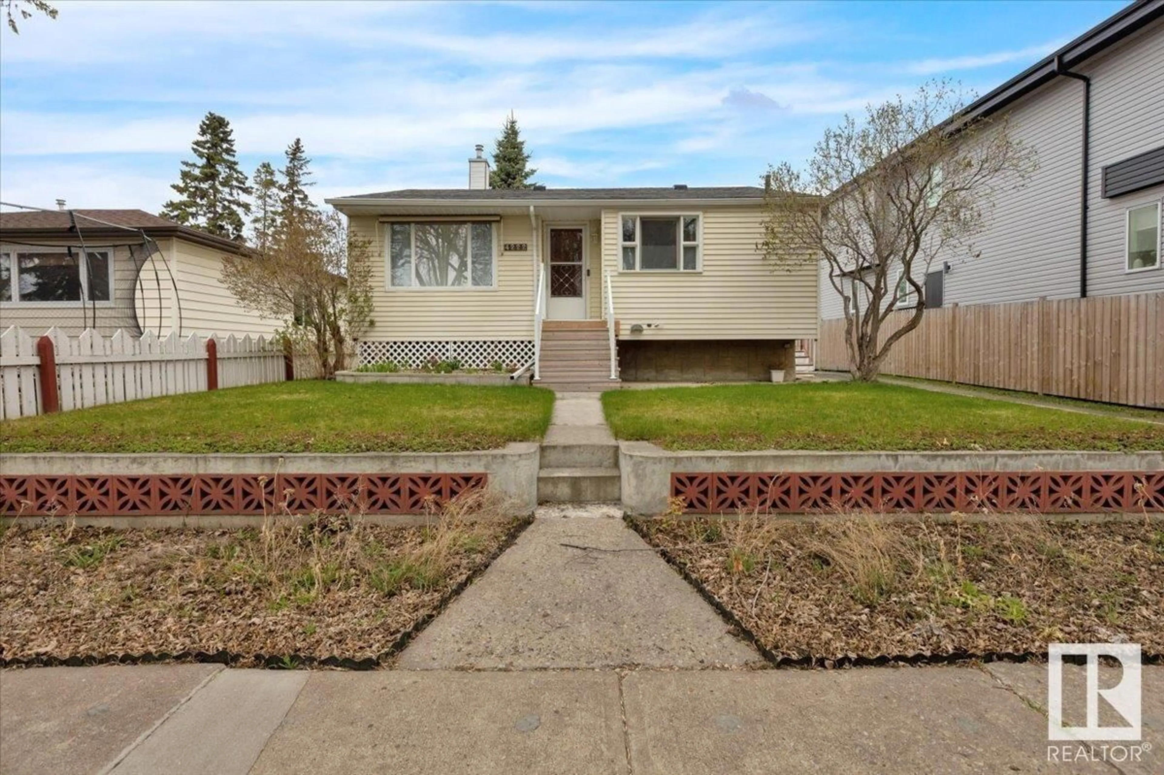 Home with vinyl exterior material, street for 4222 113 AV, Edmonton Alberta T5W0R5