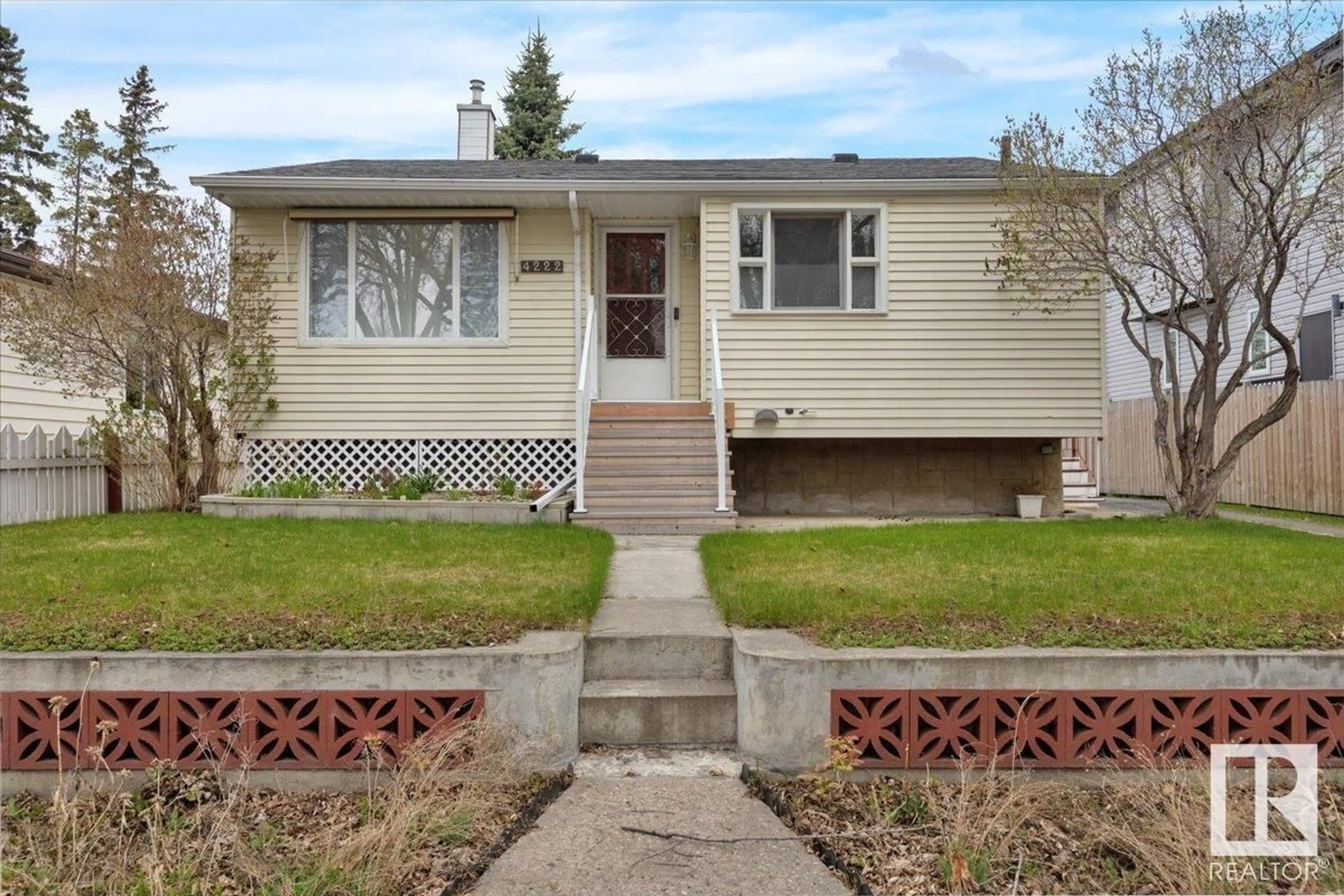 Home with vinyl exterior material, street for 4222 113 AV, Edmonton Alberta T5W0R5