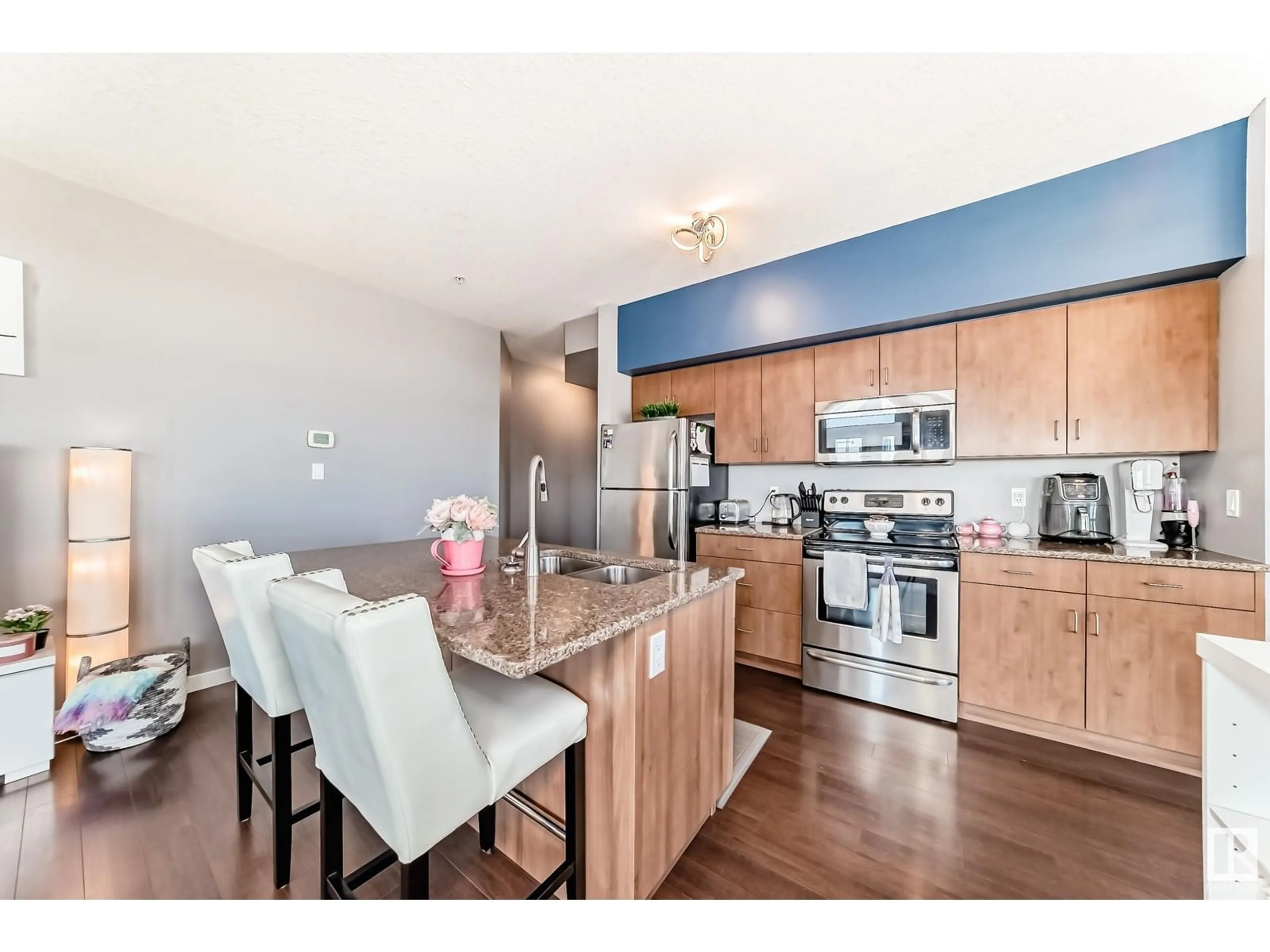 Open concept kitchen, wood/laminate floor for #413 - 10518 113 ST, Edmonton Alberta T5H3H5