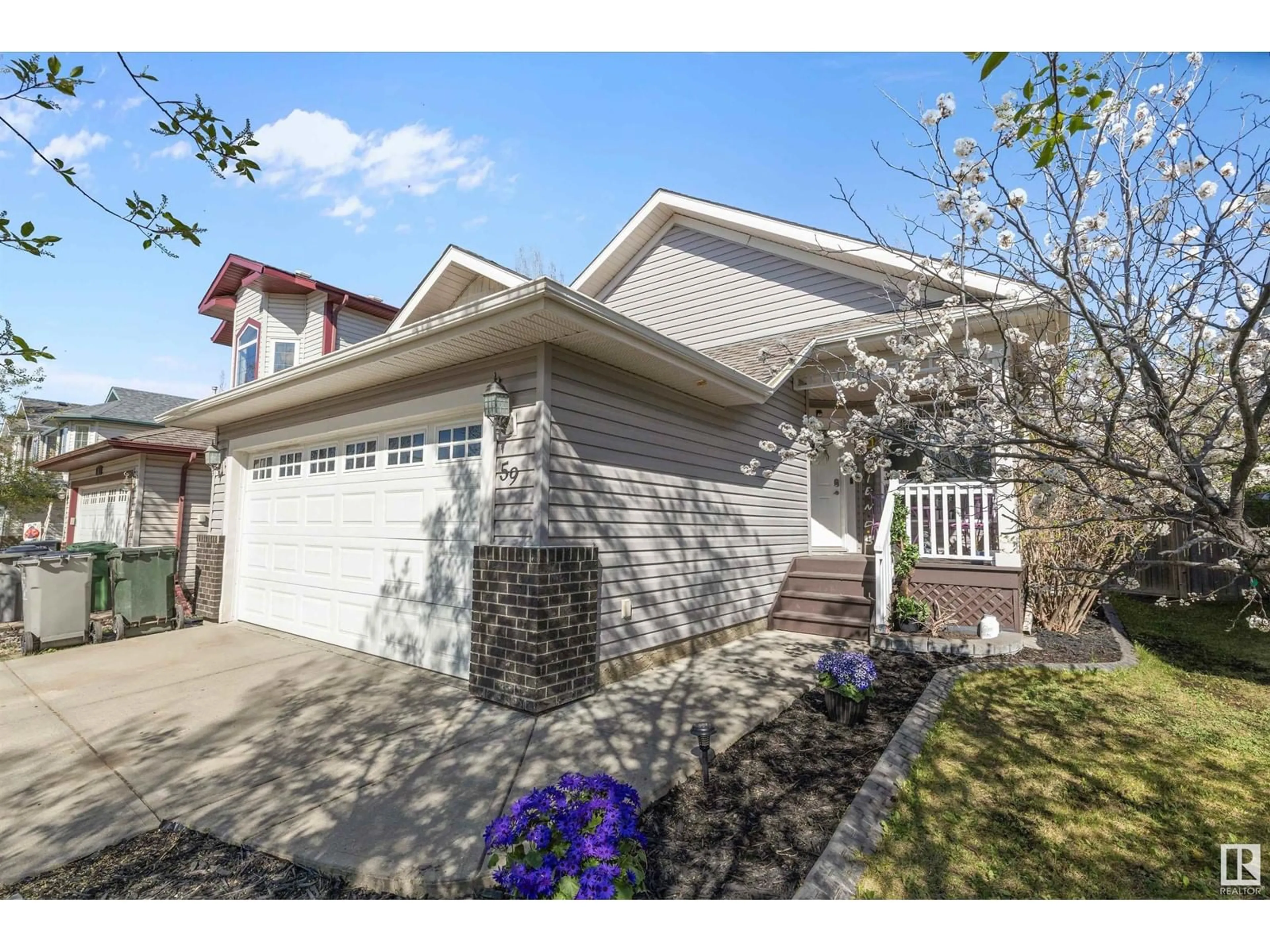 Home with vinyl exterior material, street for 59 BONIN CR, Beaumont Alberta T4X1R9