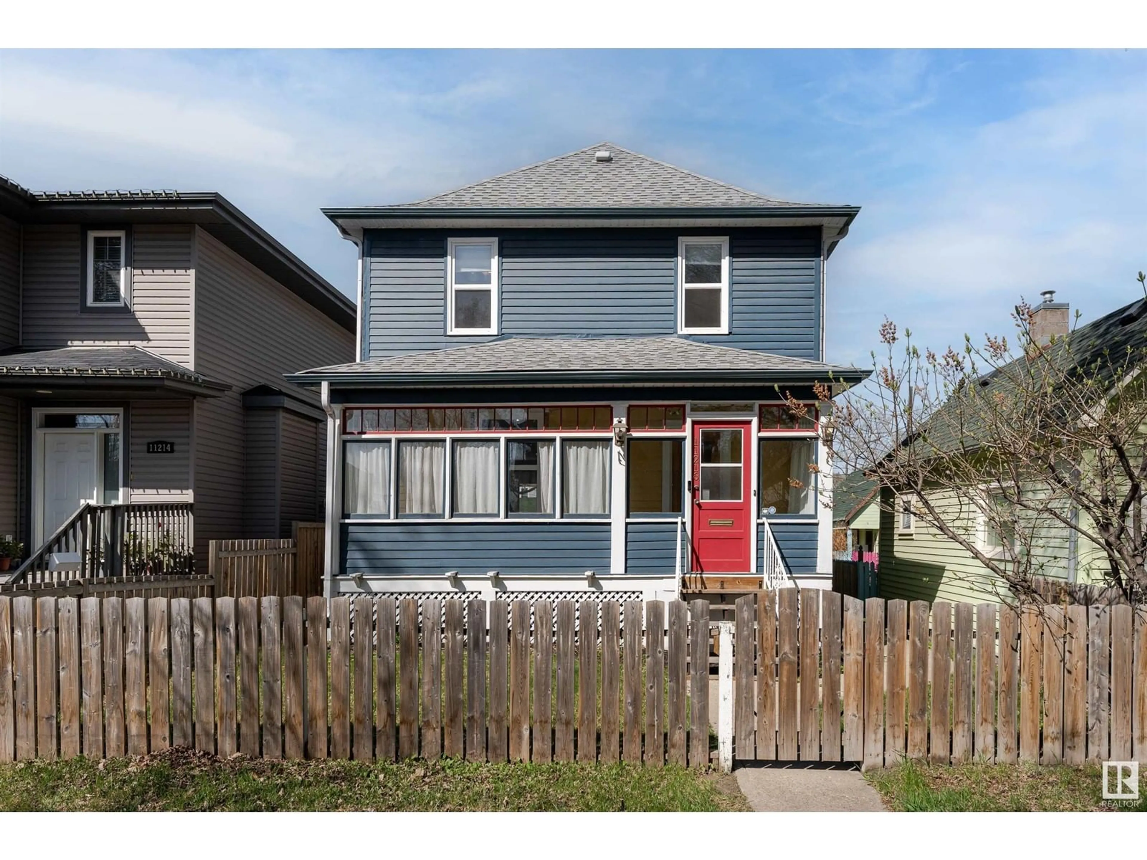 Home with vinyl exterior material, street for NW - 11216 91 ST, Edmonton Alberta T5B4A2