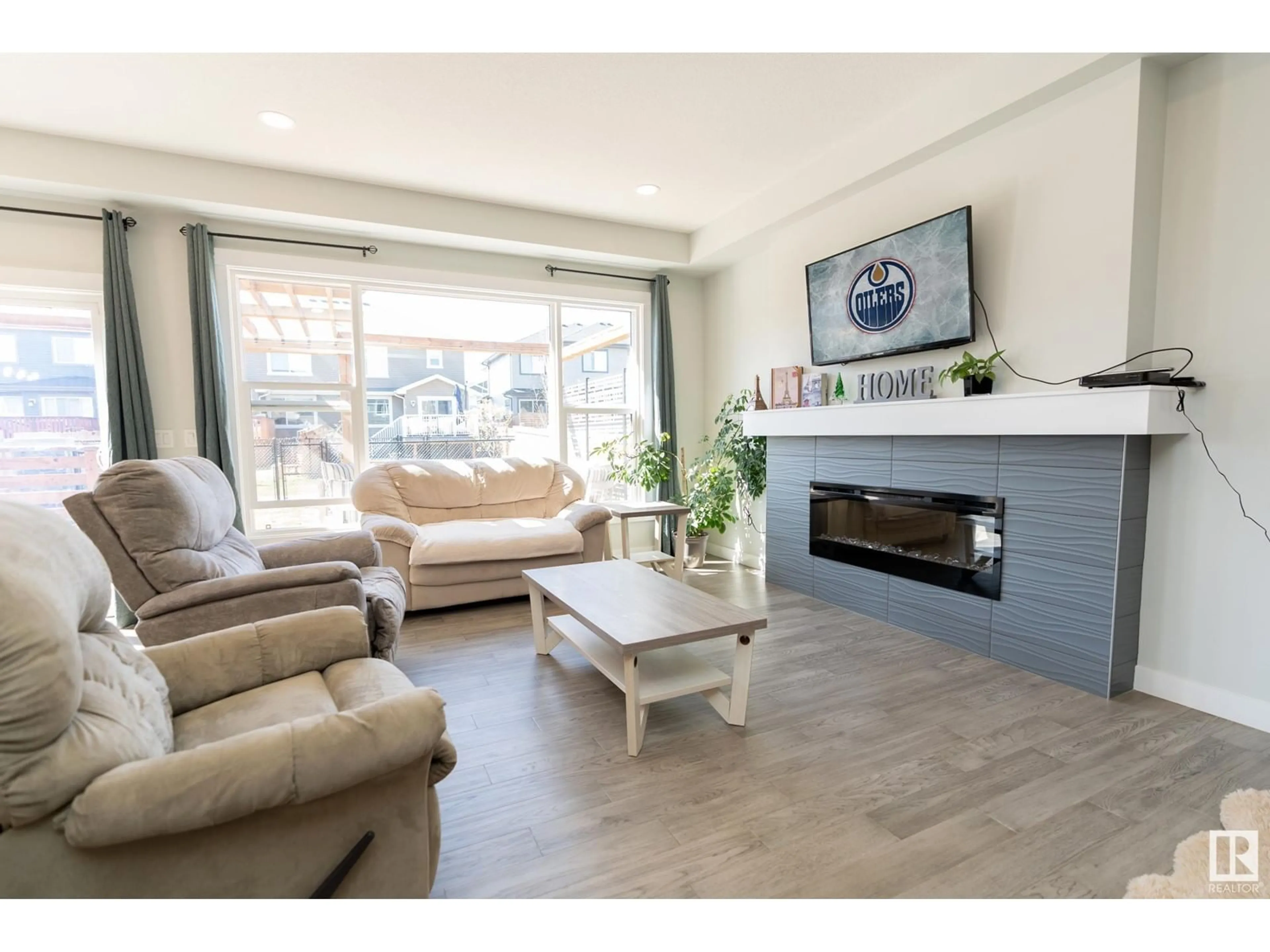 Living room with furniture, wood/laminate floor for 315 BALSAM LI, Leduc Alberta T9E1L4
