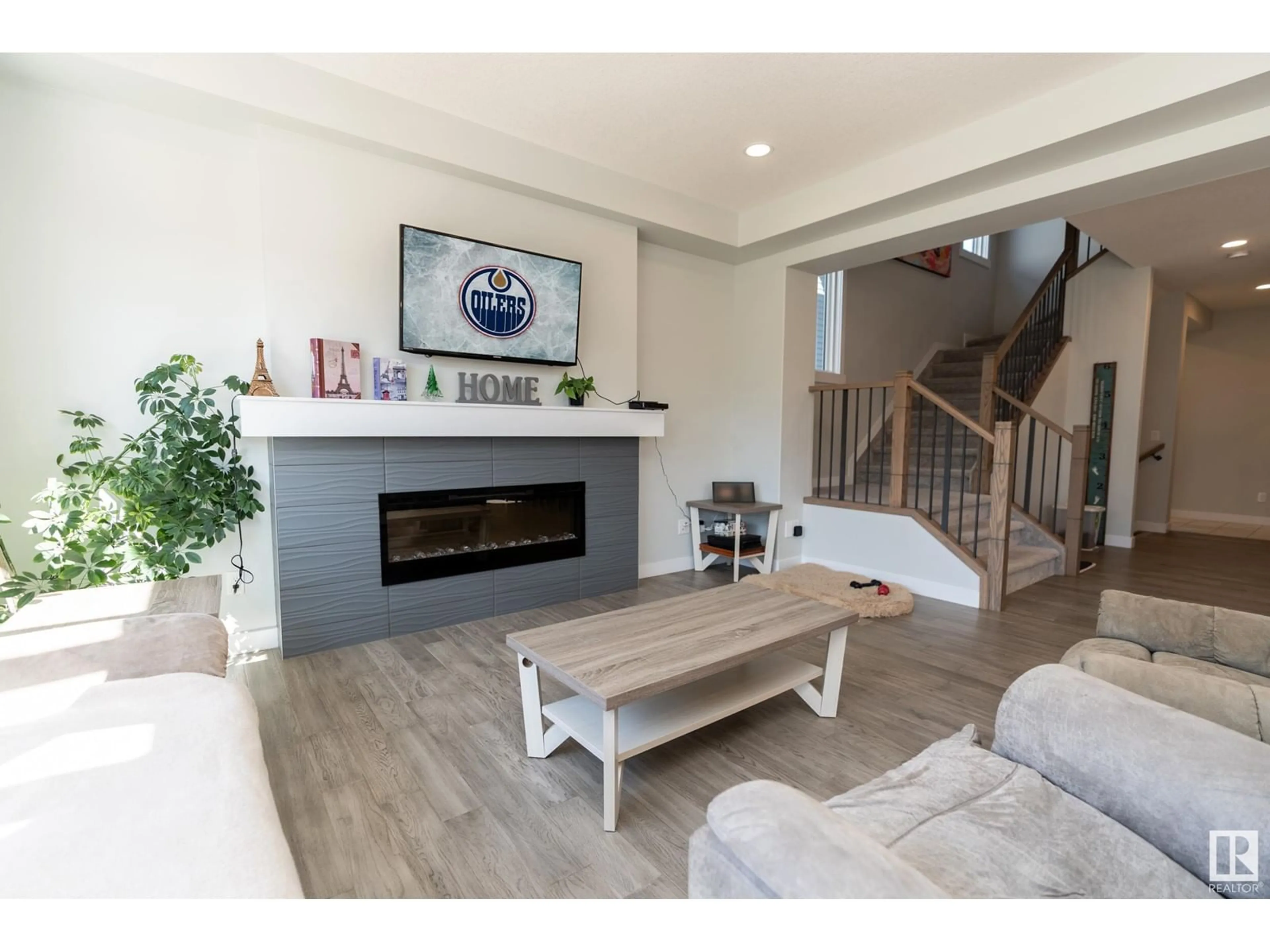 Living room with furniture, wood/laminate floor for 315 BALSAM LI, Leduc Alberta T9E1L4