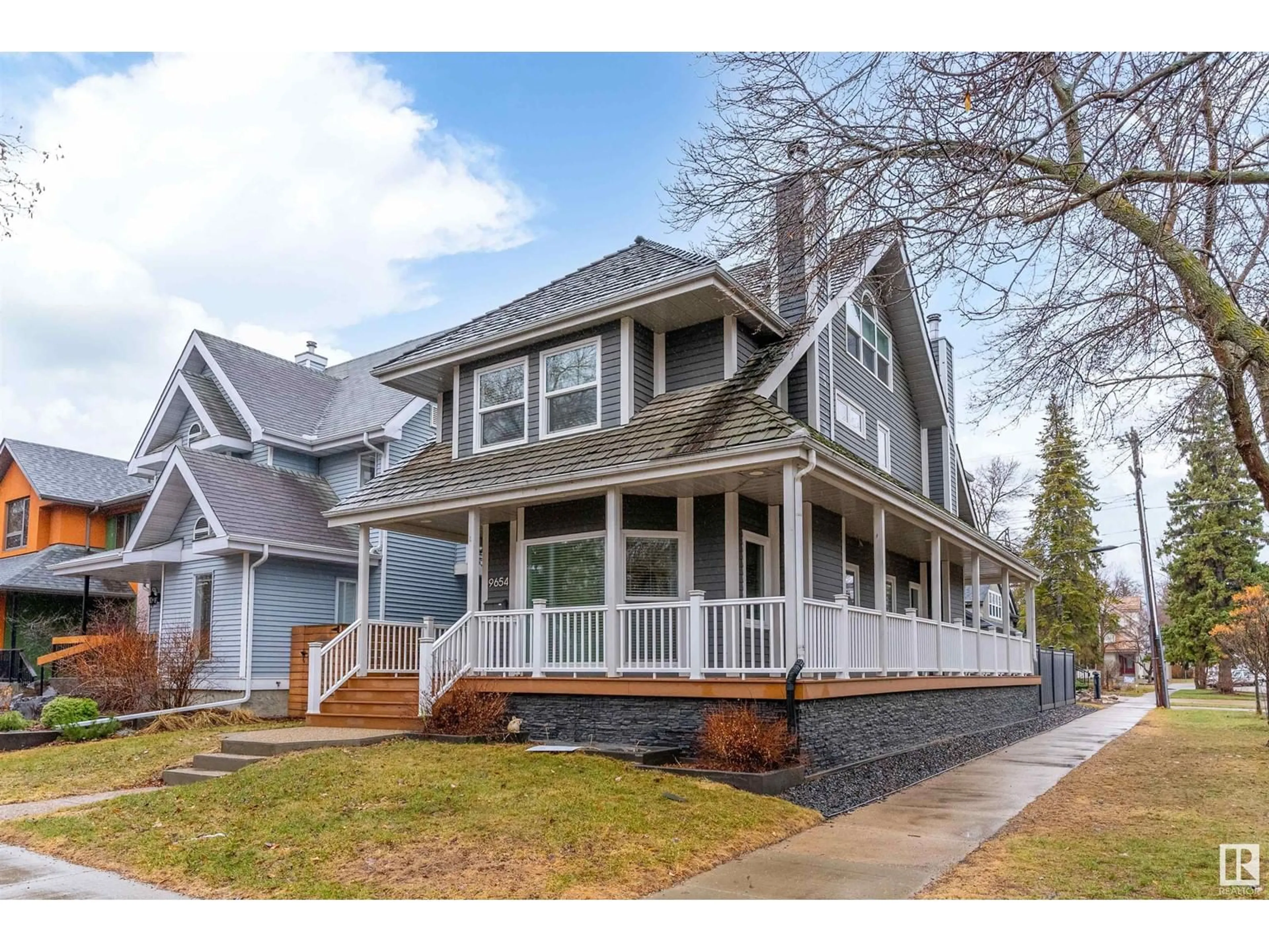 Home with vinyl exterior material, street for 9654 100 ST, Edmonton Alberta T5K0T6