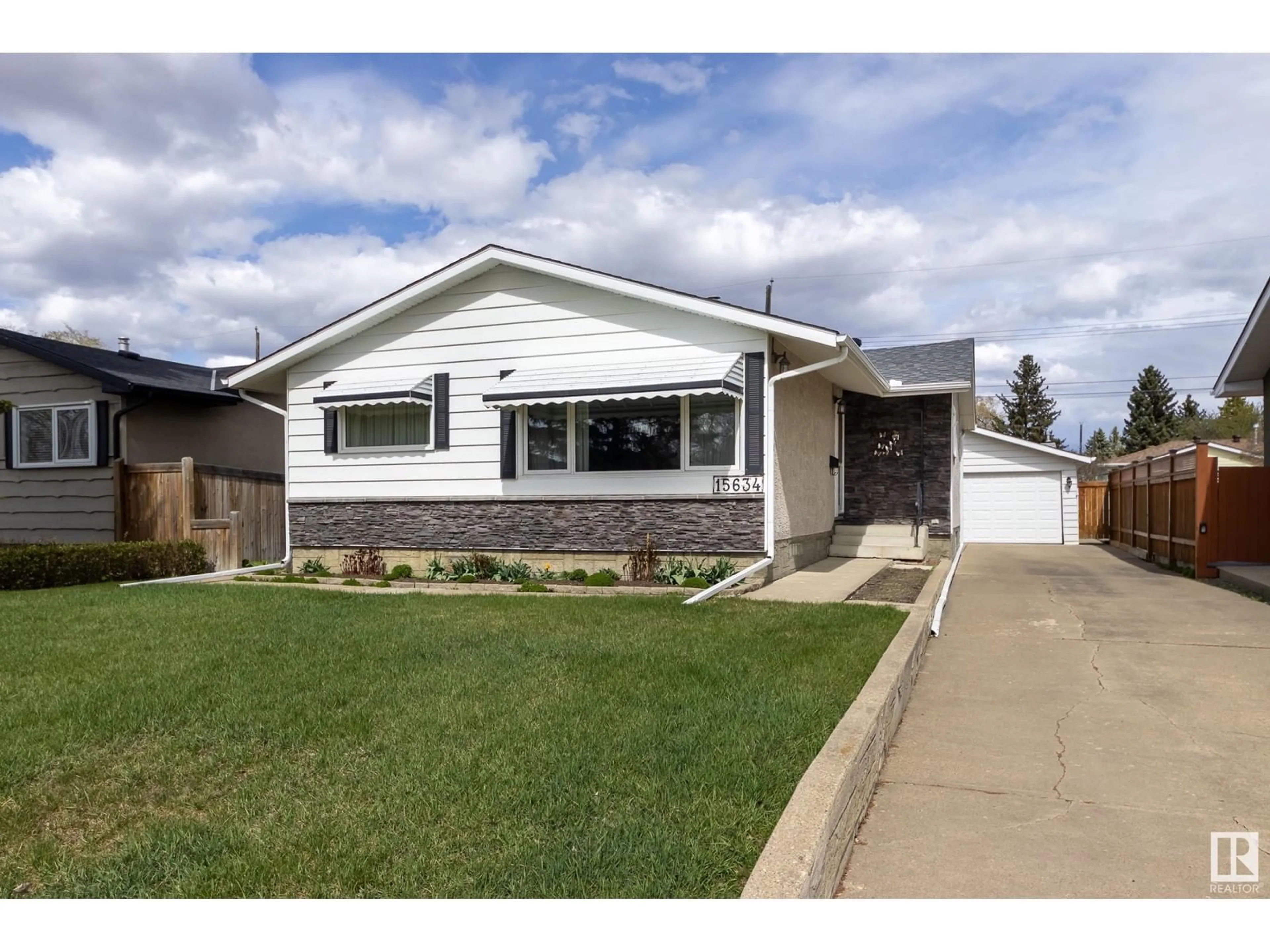 Home with vinyl exterior material, street for 15634 83 AV, Edmonton Alberta T5R3T7