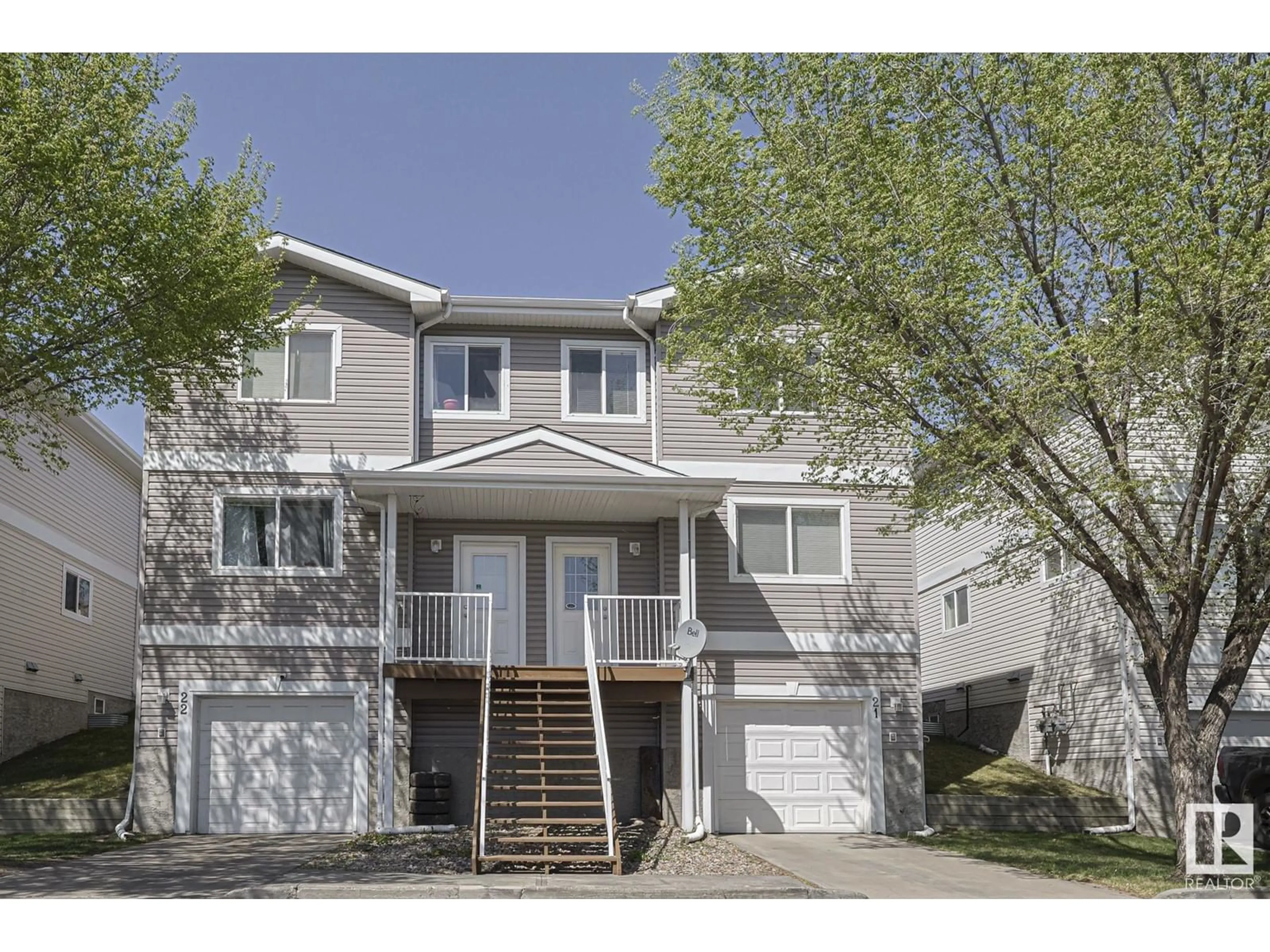 Home with vinyl exterior material, street for #21 - 130 HYNDMAN CR, Edmonton Alberta T5A0E8