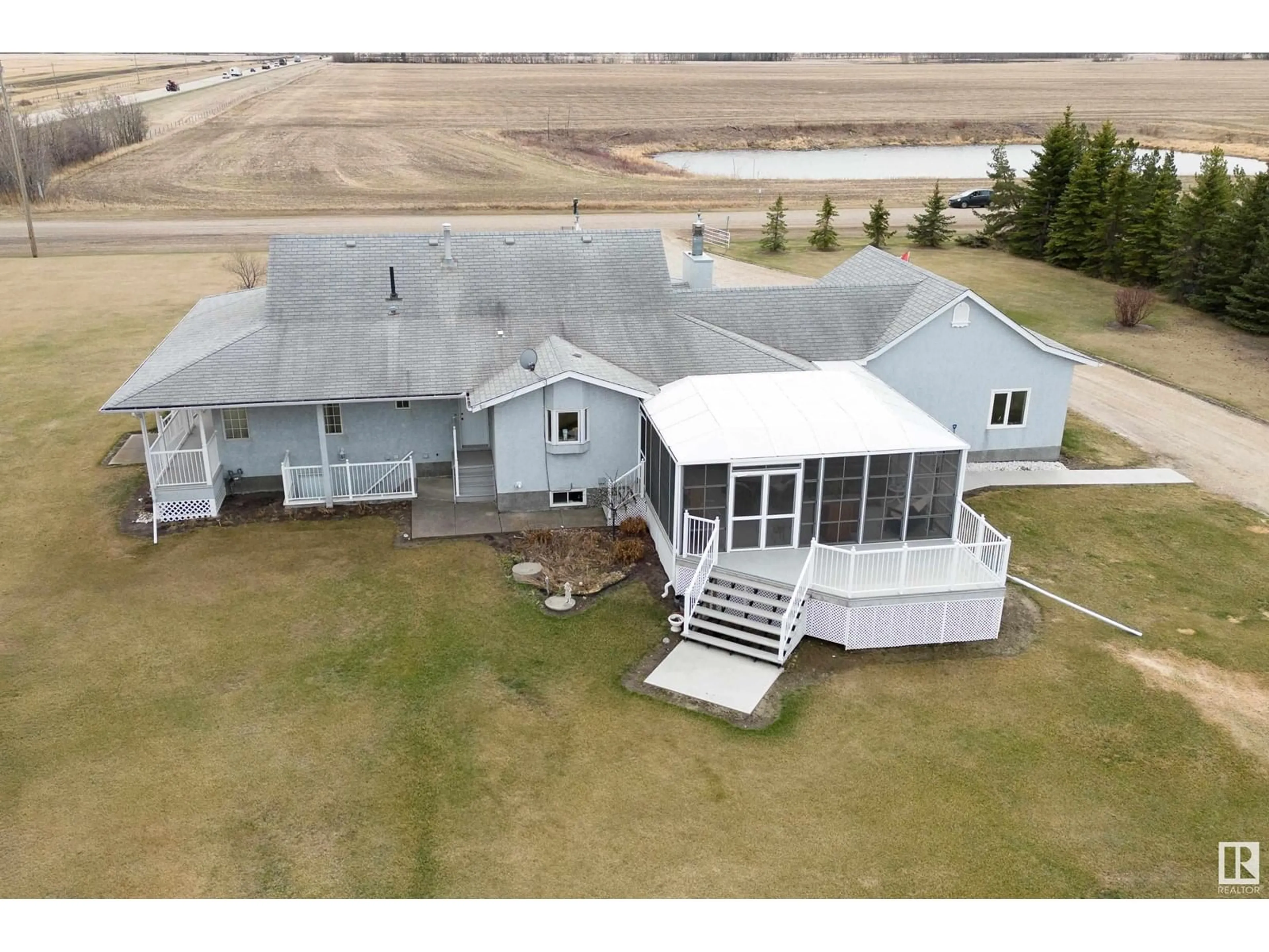 A pic from outside/outdoor area/front of a property/back of a property/a pic from drone, building for 26304 TWP RD 502, Rural Leduc County Alberta T9G0G8