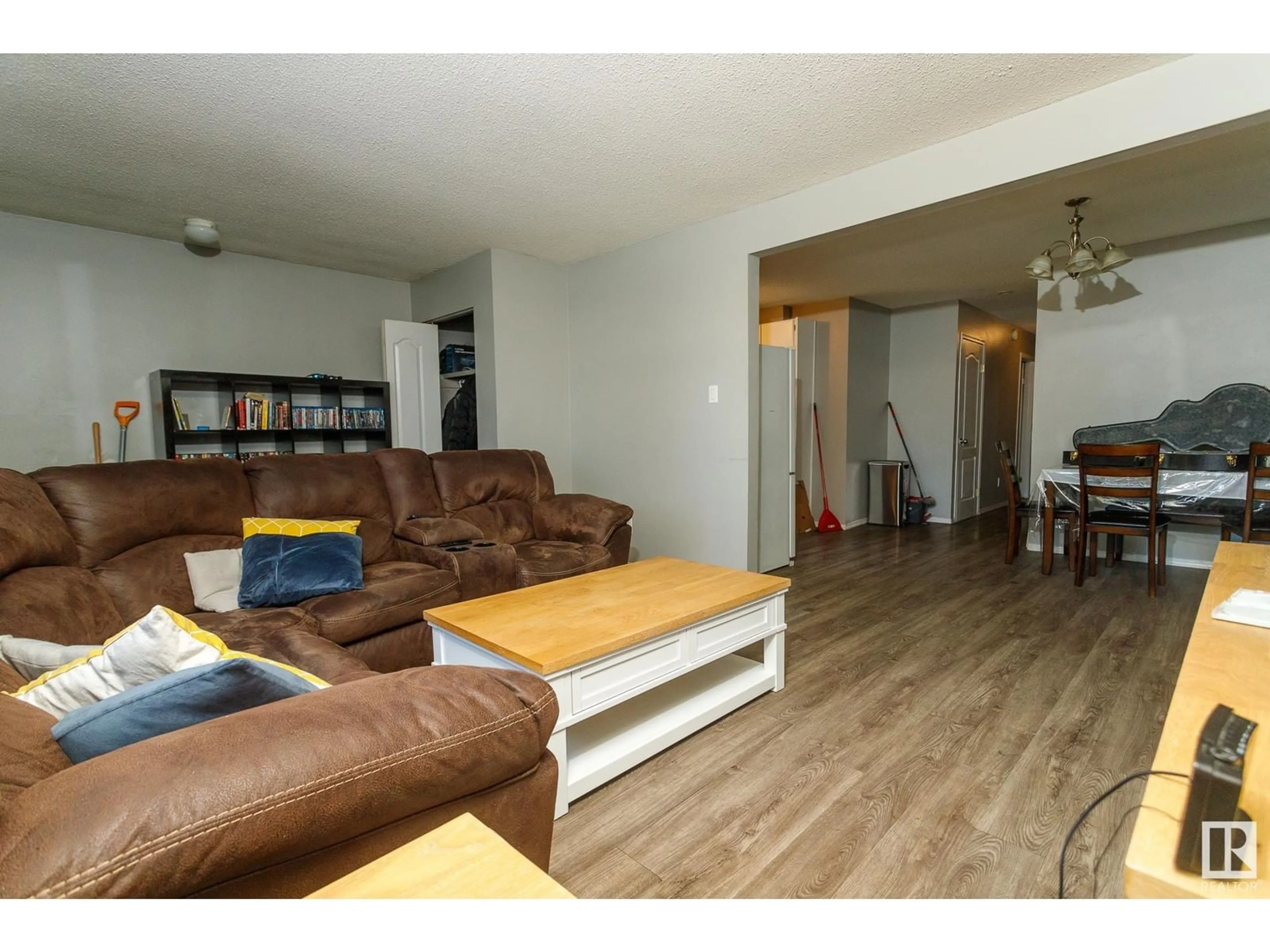 Living room with furniture, wood/laminate floor for NW - 12107-12109 89 ST, Edmonton Alberta T5B3W3