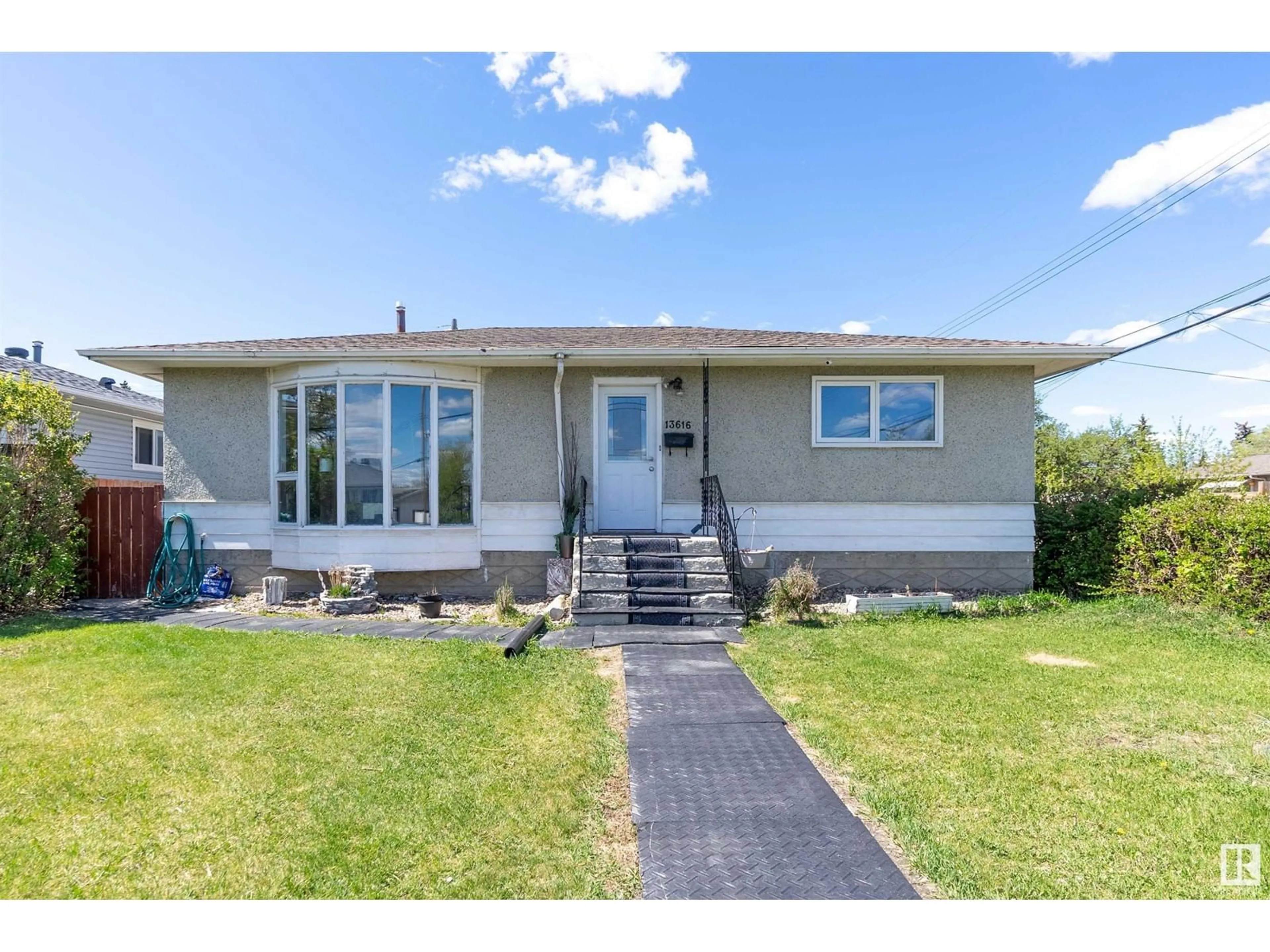 Home with vinyl exterior material, street for NW - 13616 111 ST, Edmonton Alberta T5E4Z8