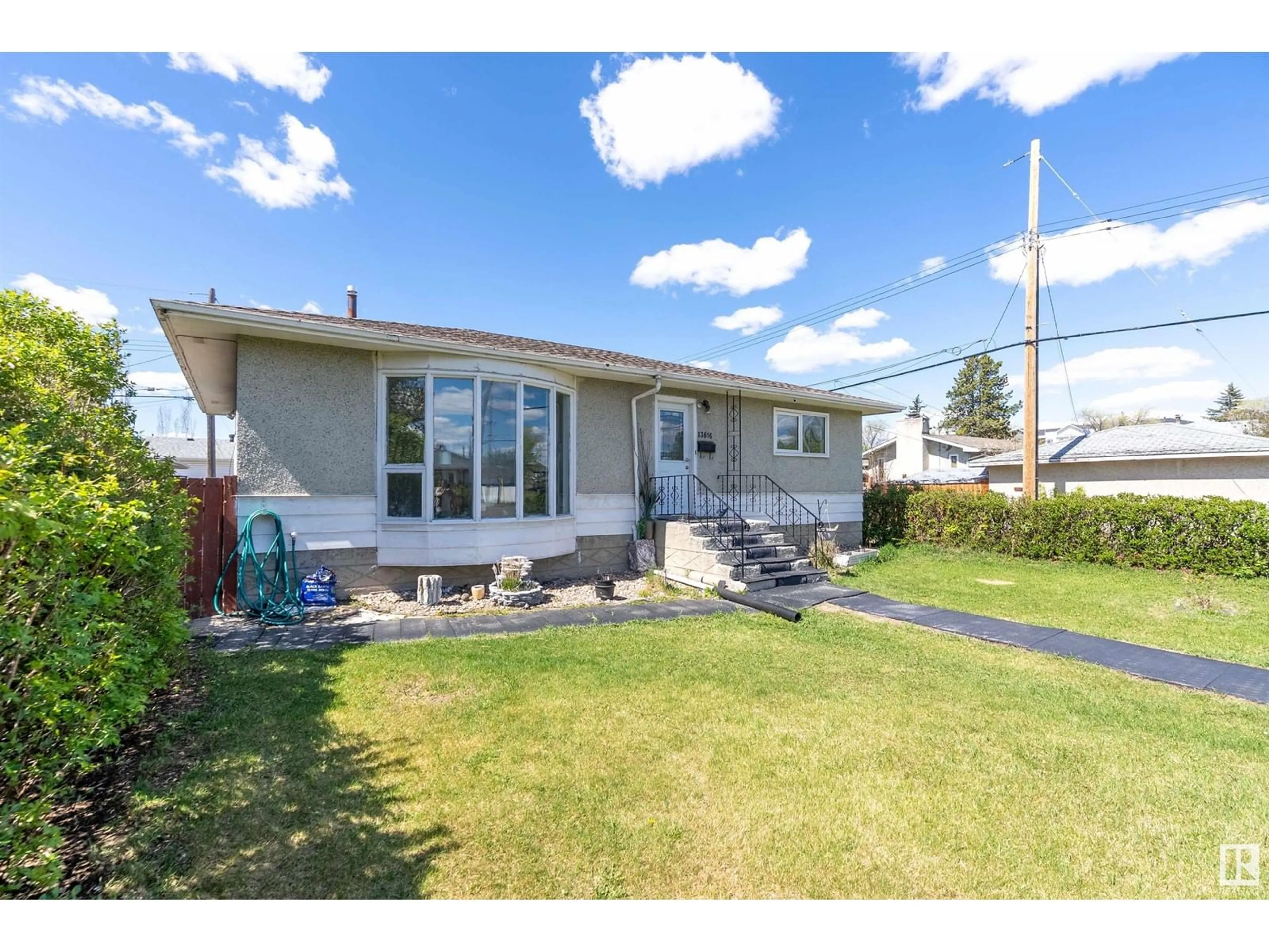 Home with vinyl exterior material, street for NW - 13616 111 ST, Edmonton Alberta T5E4Z8