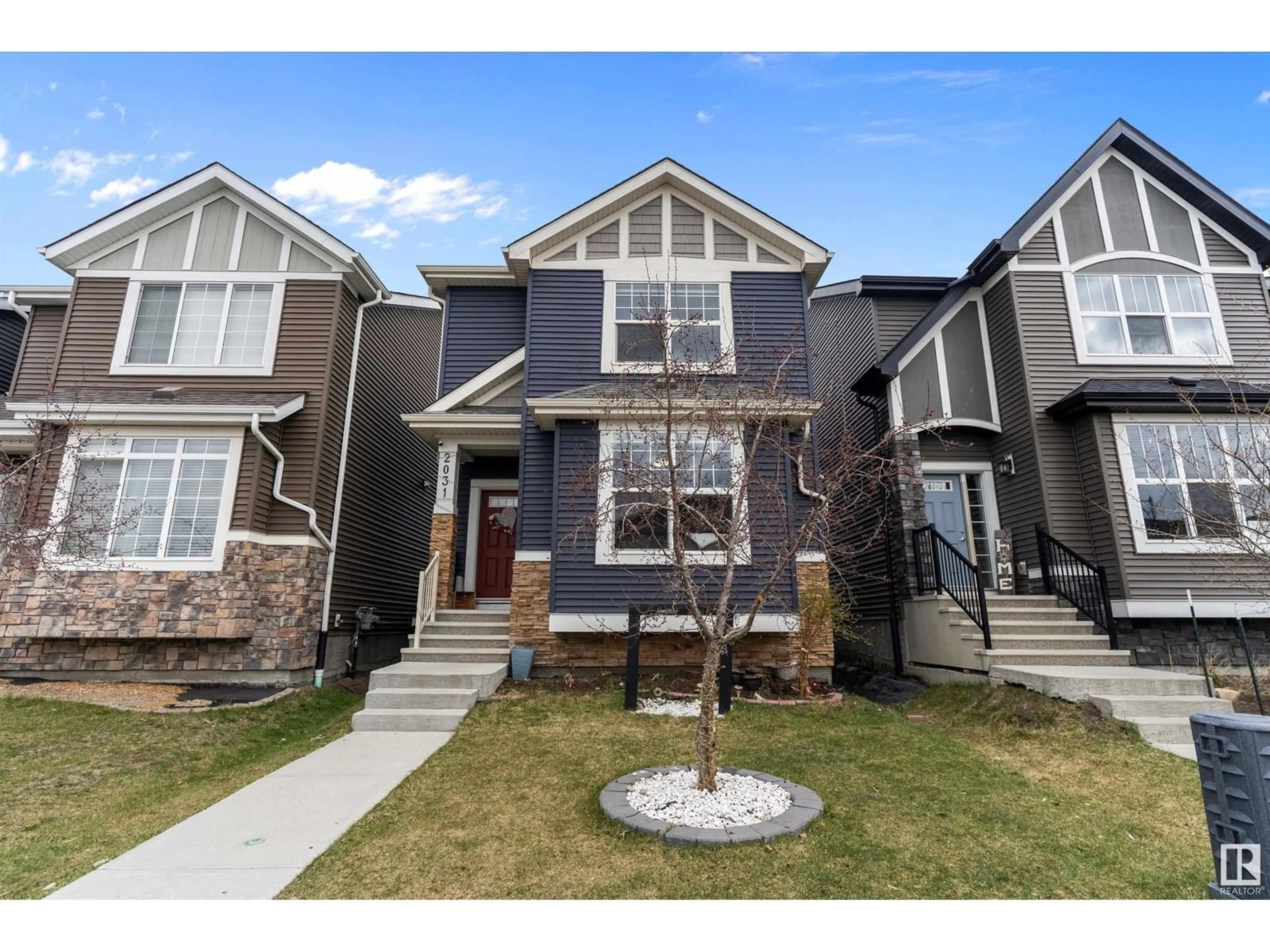 Home with vinyl exterior material, street for 2031 52 ST, Edmonton Alberta T6X1Z7