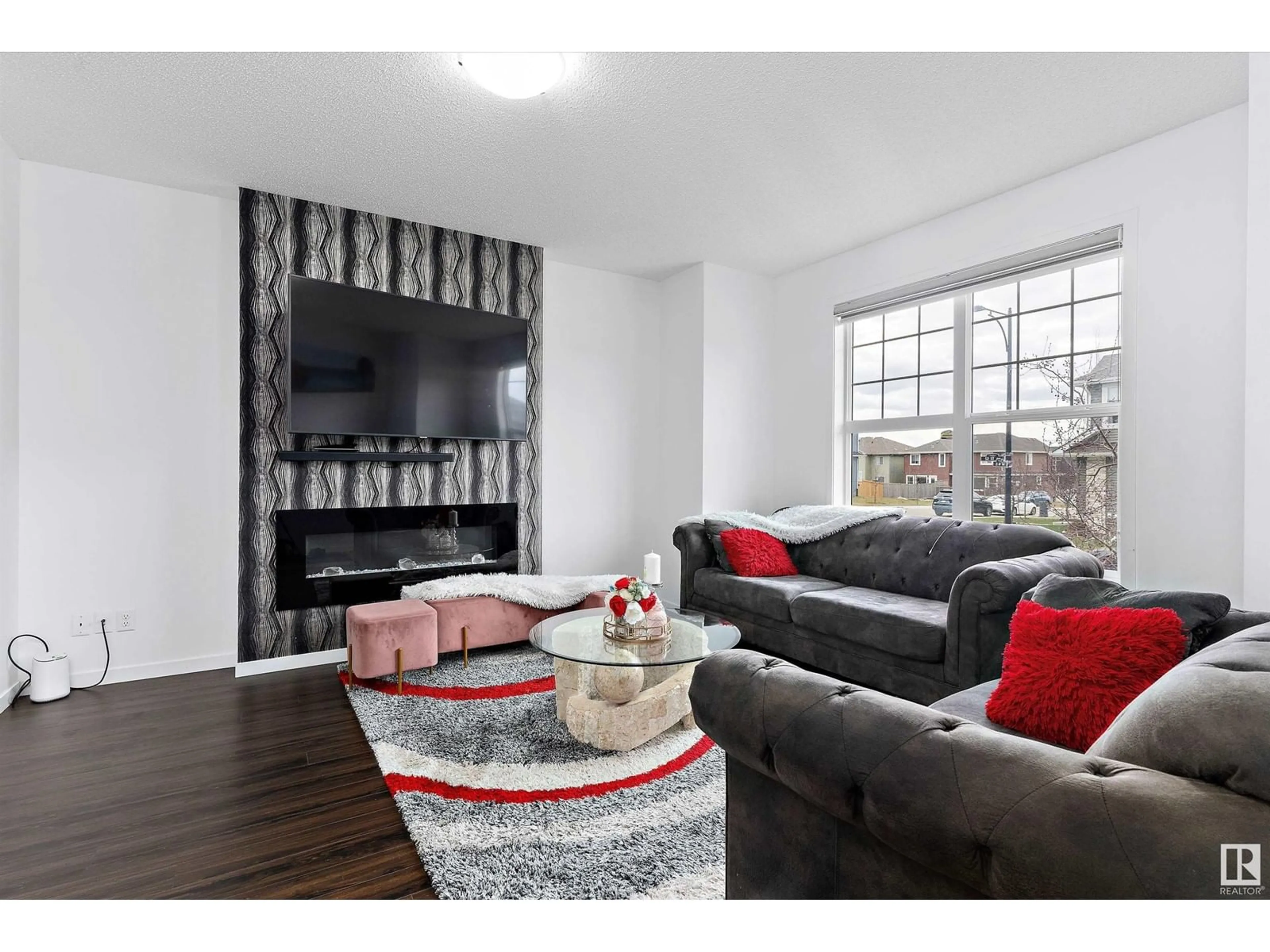 Living room with furniture, wood/laminate floor for 2031 52 ST, Edmonton Alberta T6X1Z7