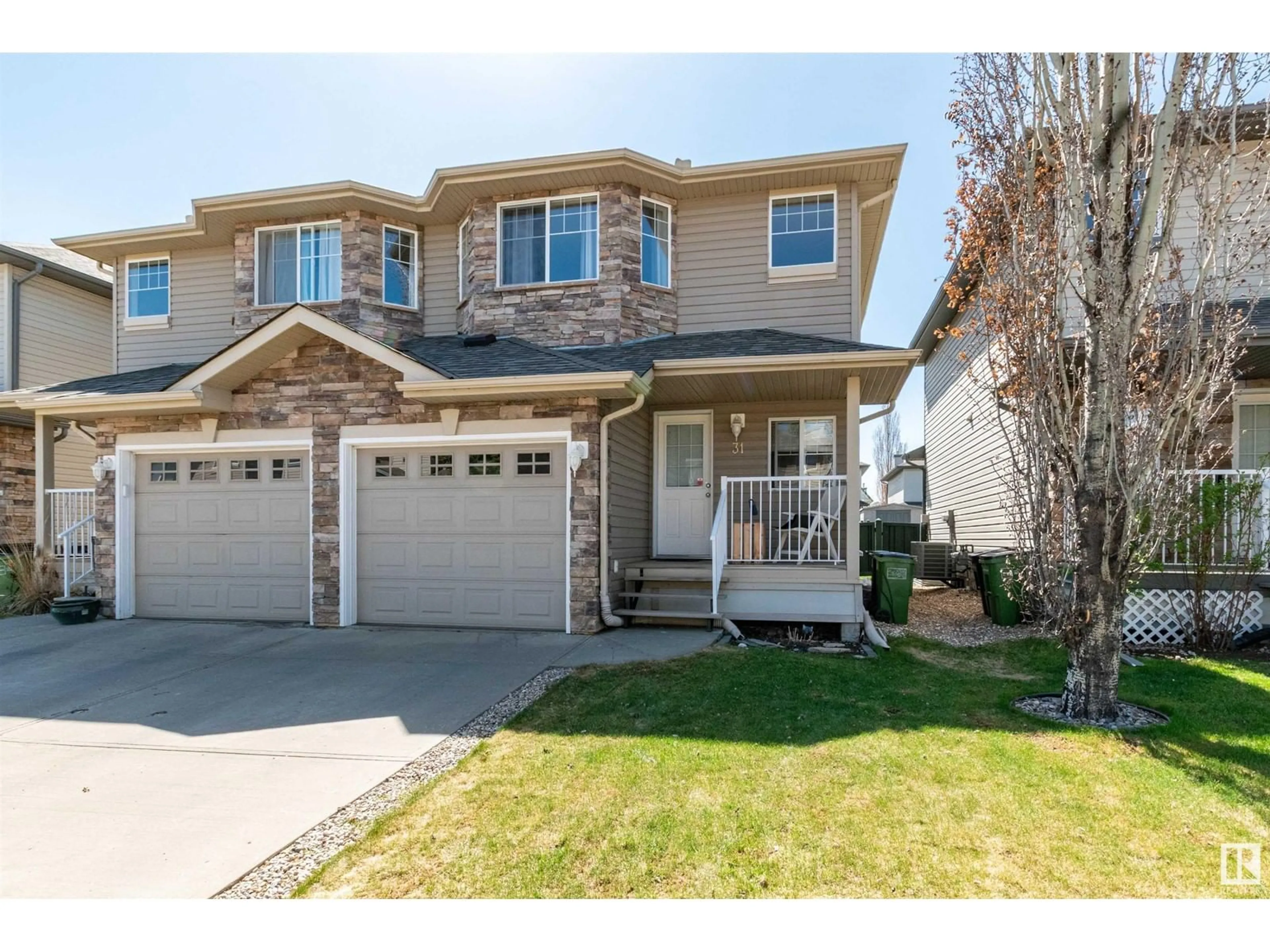 Home with vinyl exterior material, street for #31 - 12104 16 AV, Edmonton Alberta T6W1X3