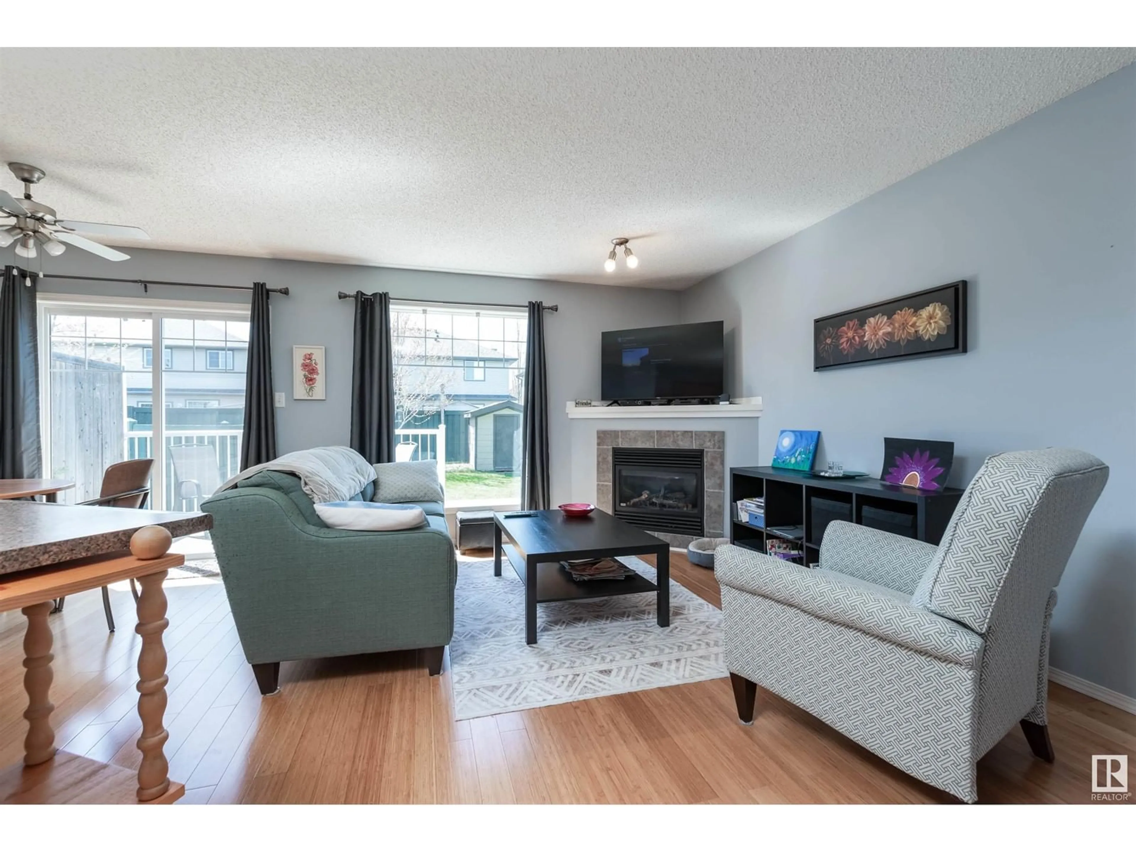 Living room with furniture, wood/laminate floor for #31 - 12104 16 AV, Edmonton Alberta T6W1X3