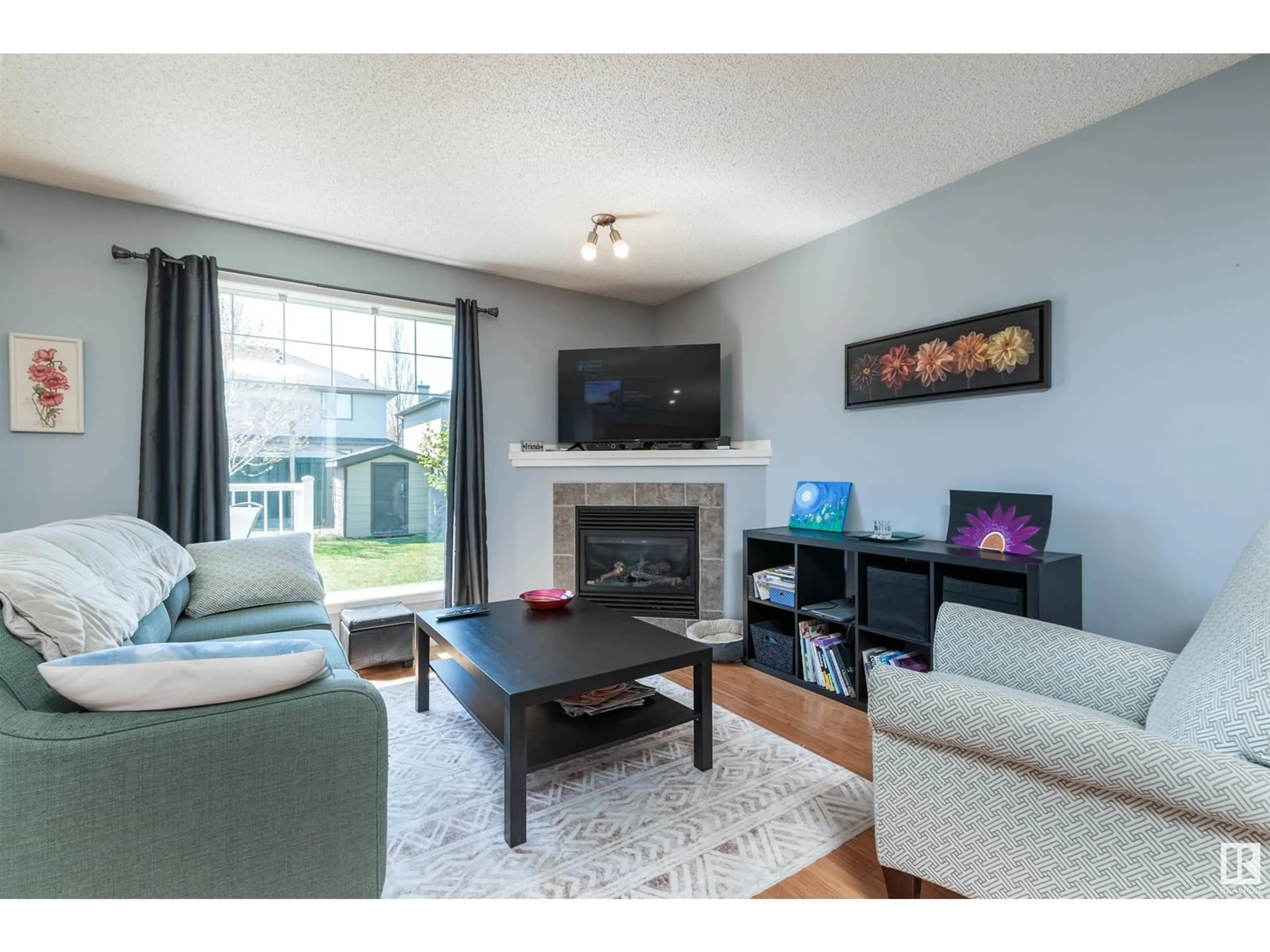Living room with furniture, wood/laminate floor for #31 - 12104 16 AV, Edmonton Alberta T6W1X3