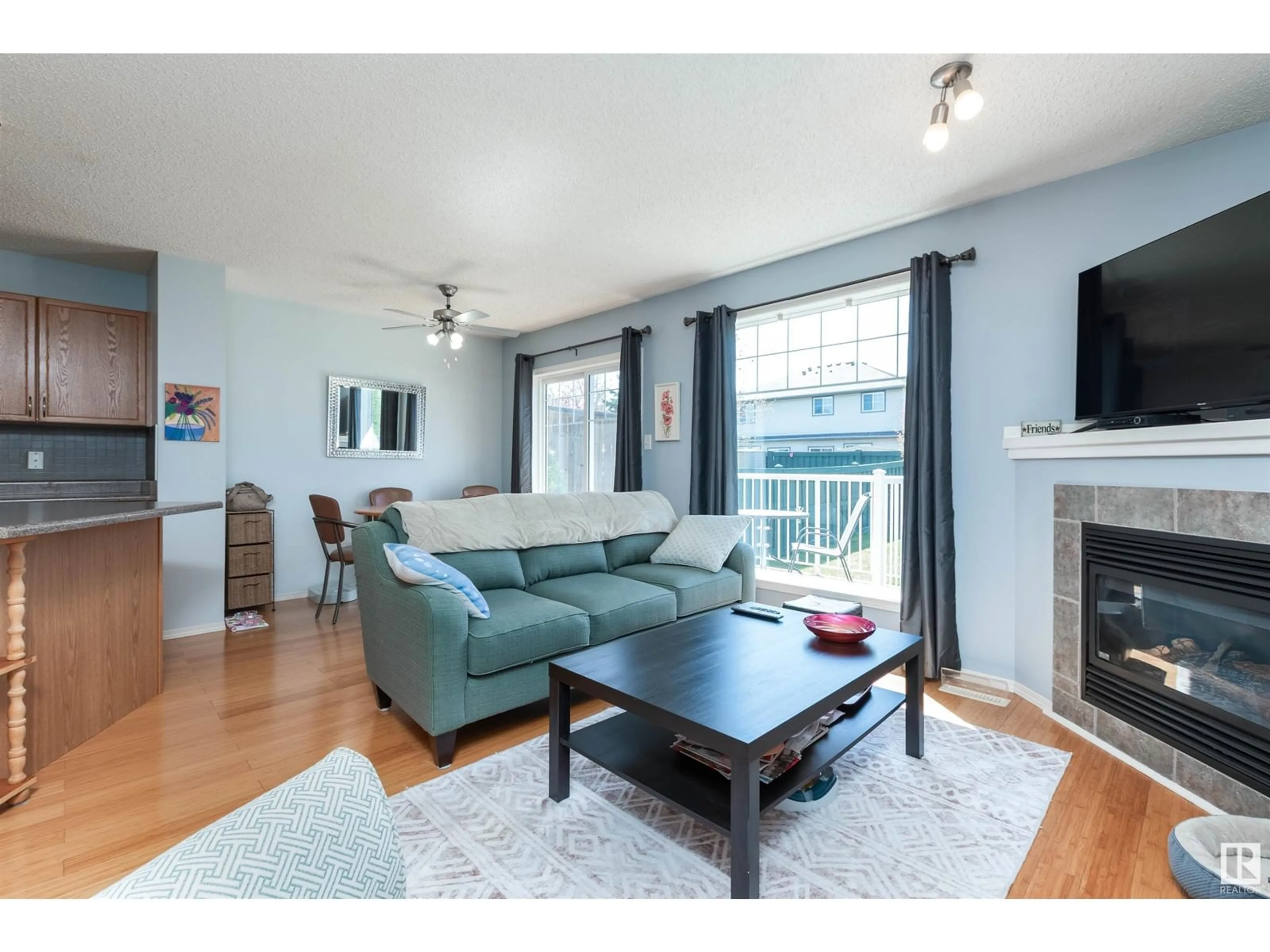 Living room with furniture, wood/laminate floor for #31 - 12104 16 AV, Edmonton Alberta T6W1X3