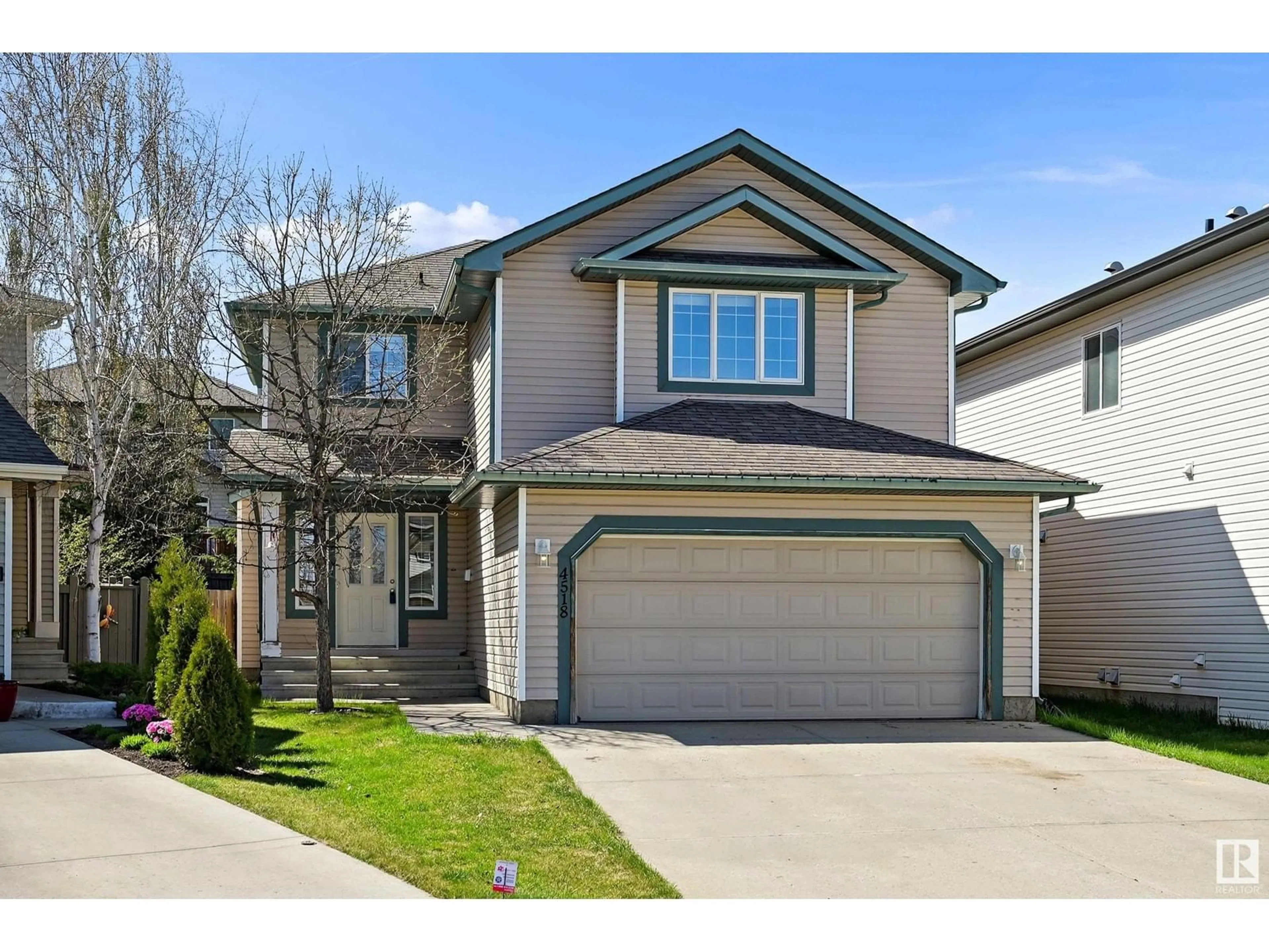 Home with vinyl exterior material, street for NW - 4518 211A ST, Edmonton Alberta T6M0G4