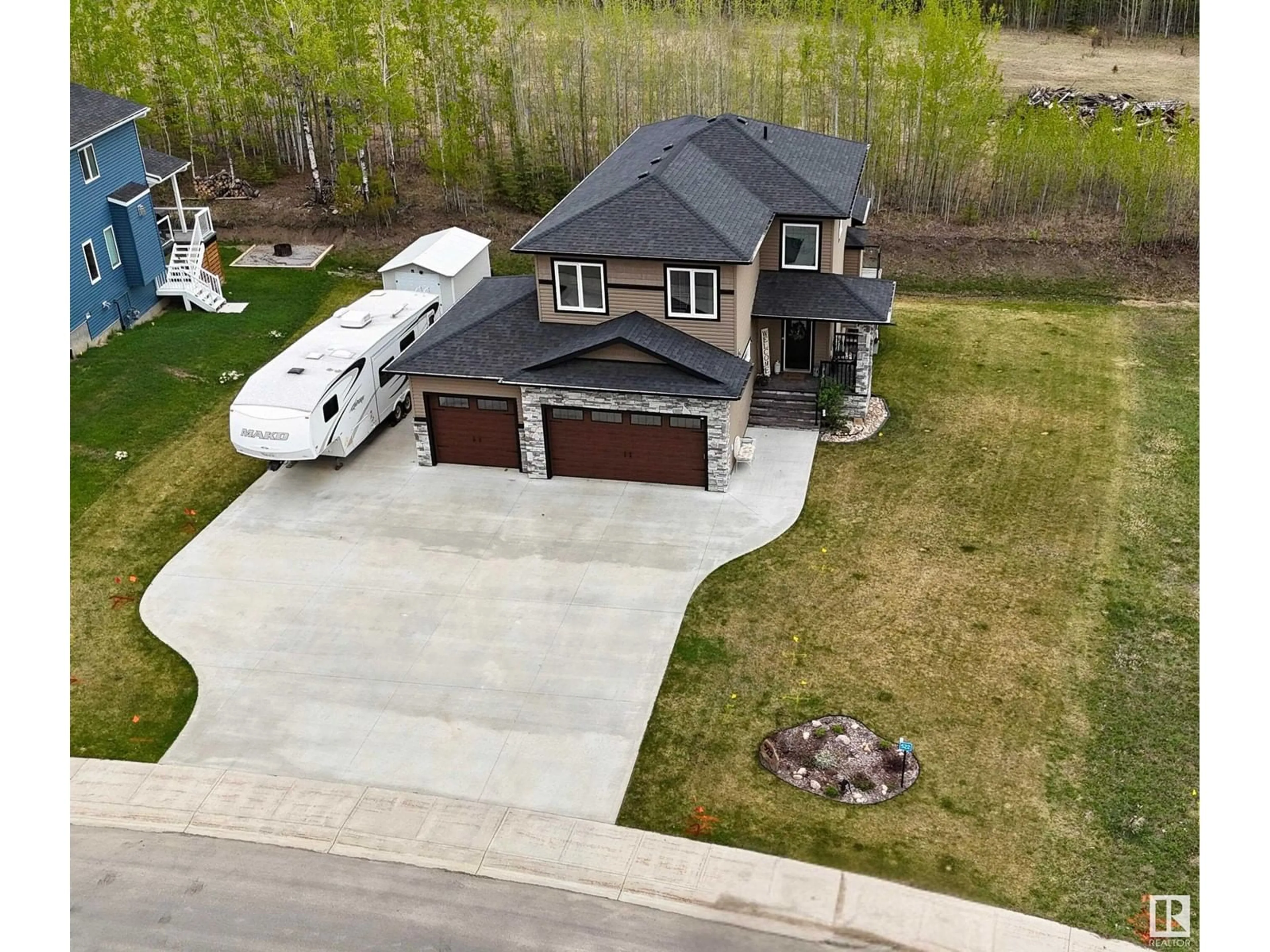 A pic from outside/outdoor area/front of a property/back of a property/a pic from drone, street for 522 49119 RR73, Rural Brazeau County Alberta T7A2A2