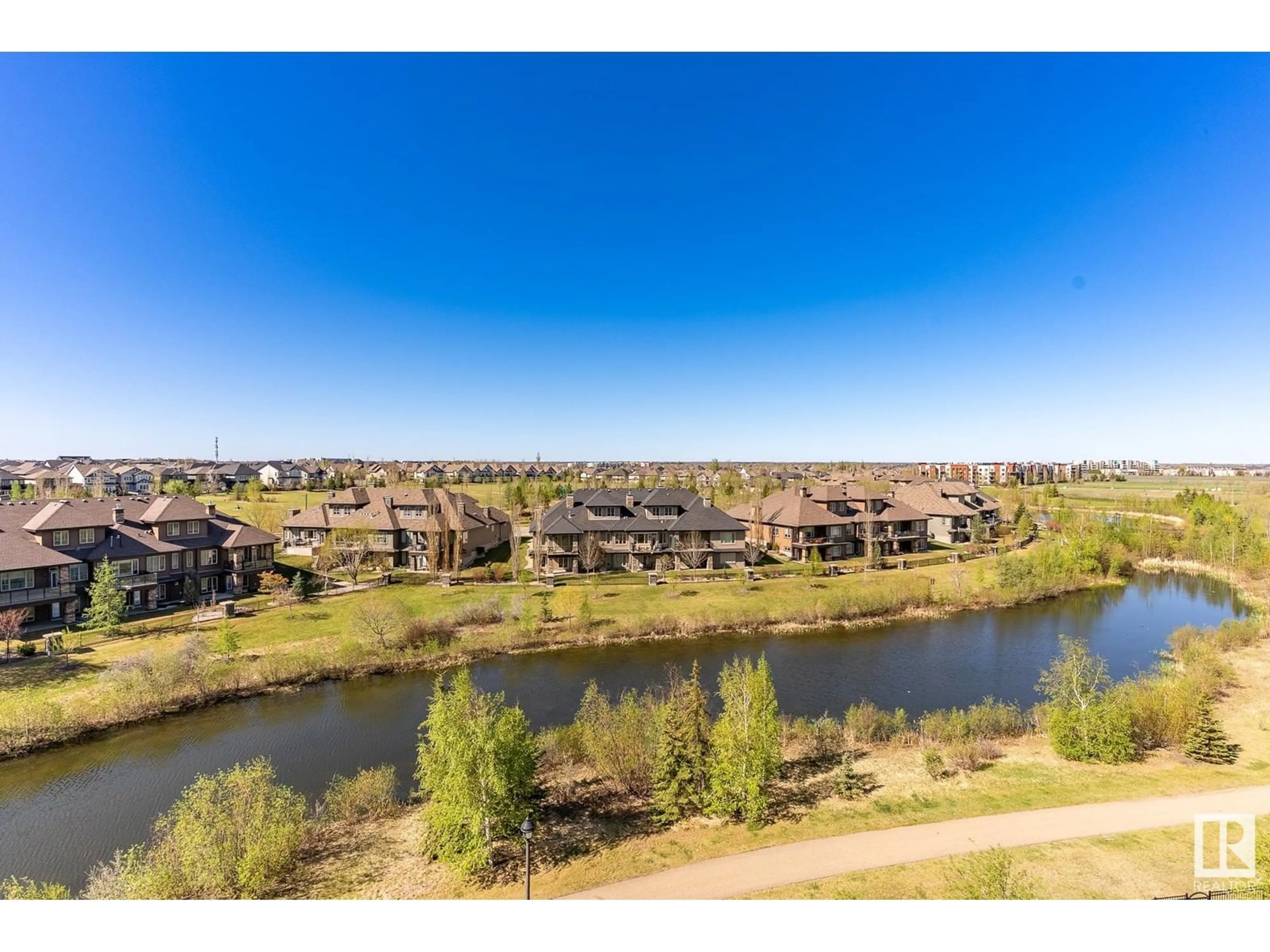A pic from outside/outdoor area/front of a property/back of a property/a pic from drone, water/lake/river/ocean view for 5151 - 526 WINDERMERE BV, Edmonton Alberta T6W2K4