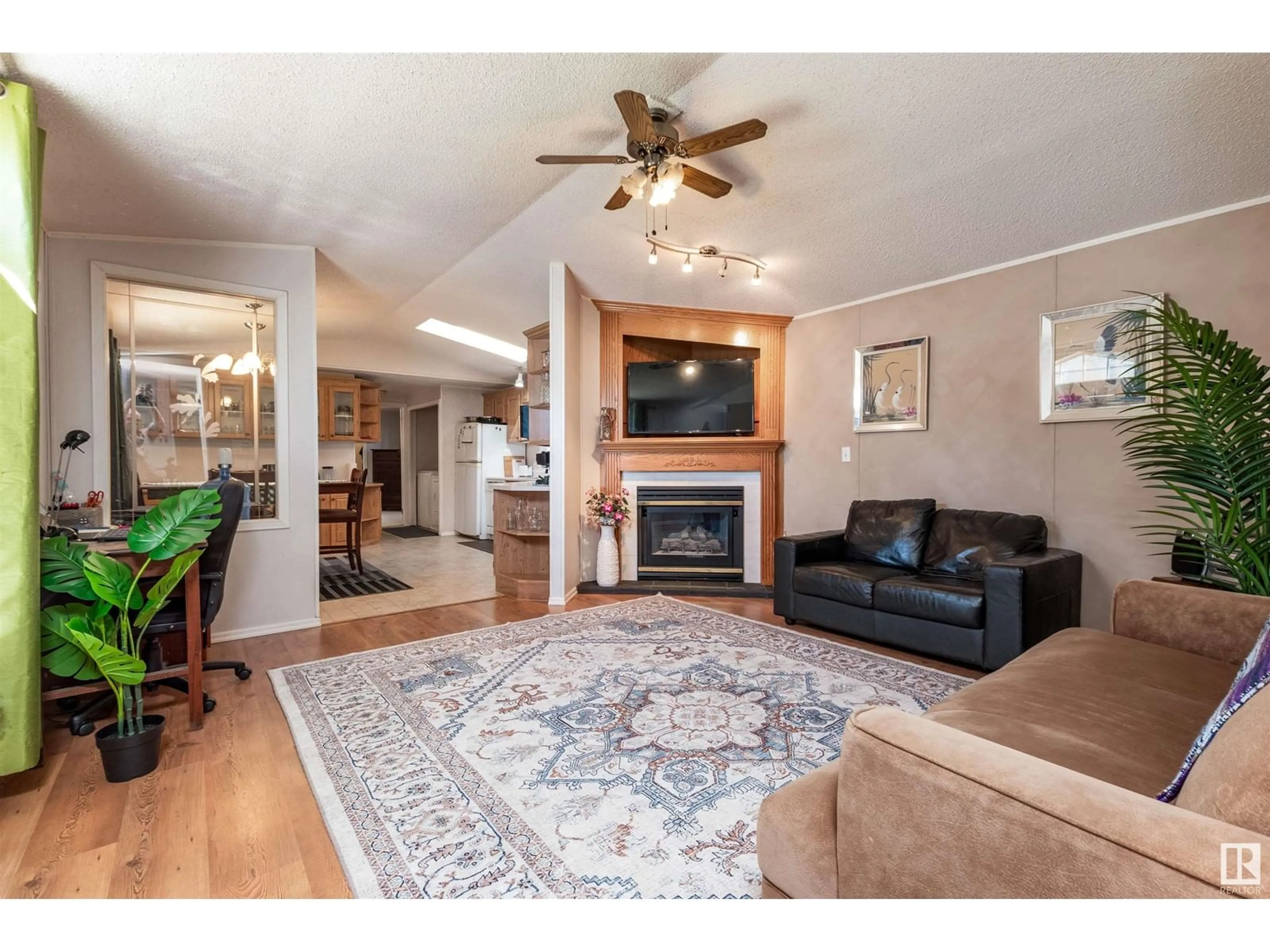 Living room with furniture, wood/laminate floor for 1508 JUBILEE DR, Sherwood Park Alberta T8H1M1