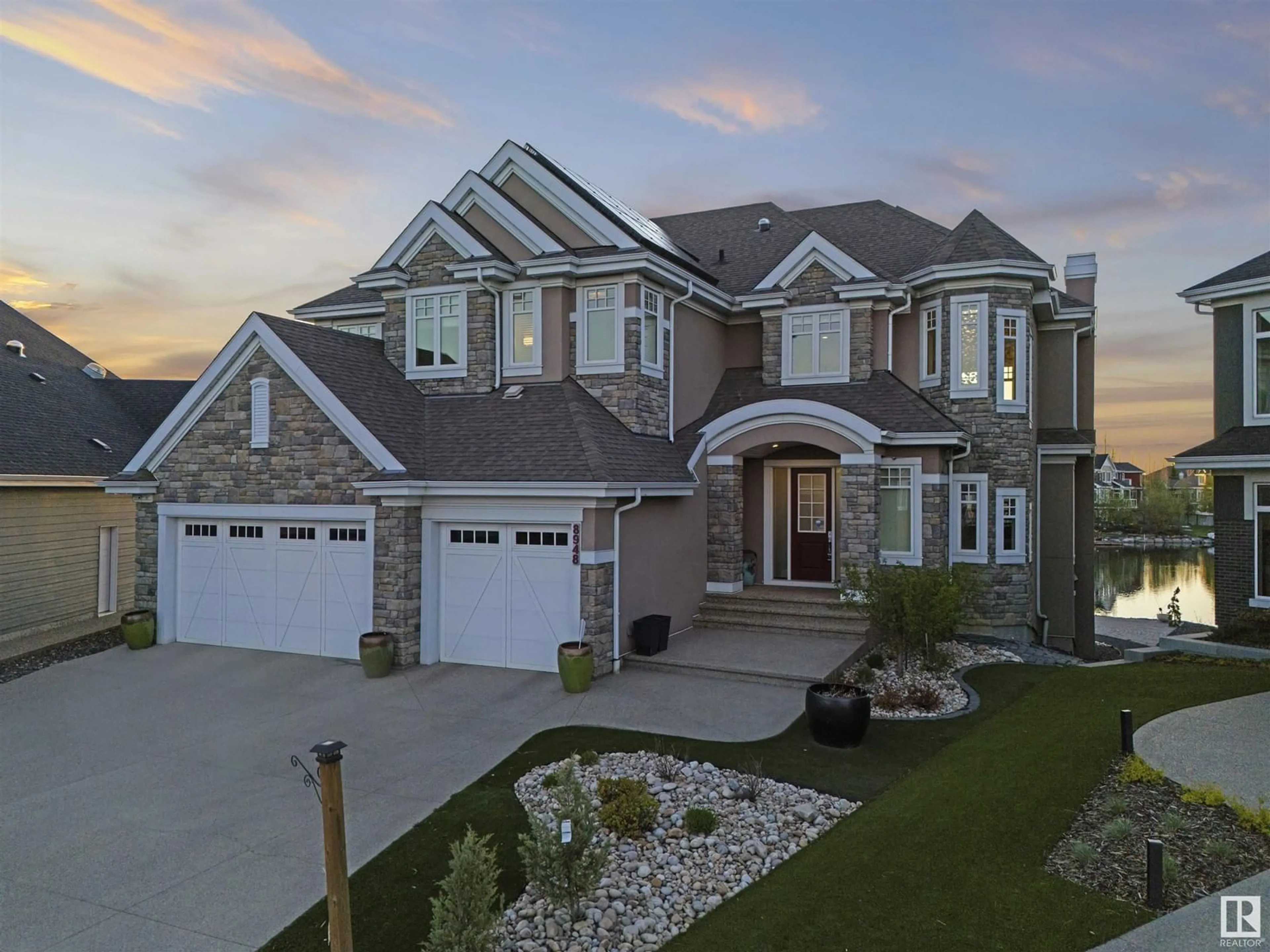Home with brick exterior material, street for SW - 8948 20 AV, Edmonton Alberta T6X2C5