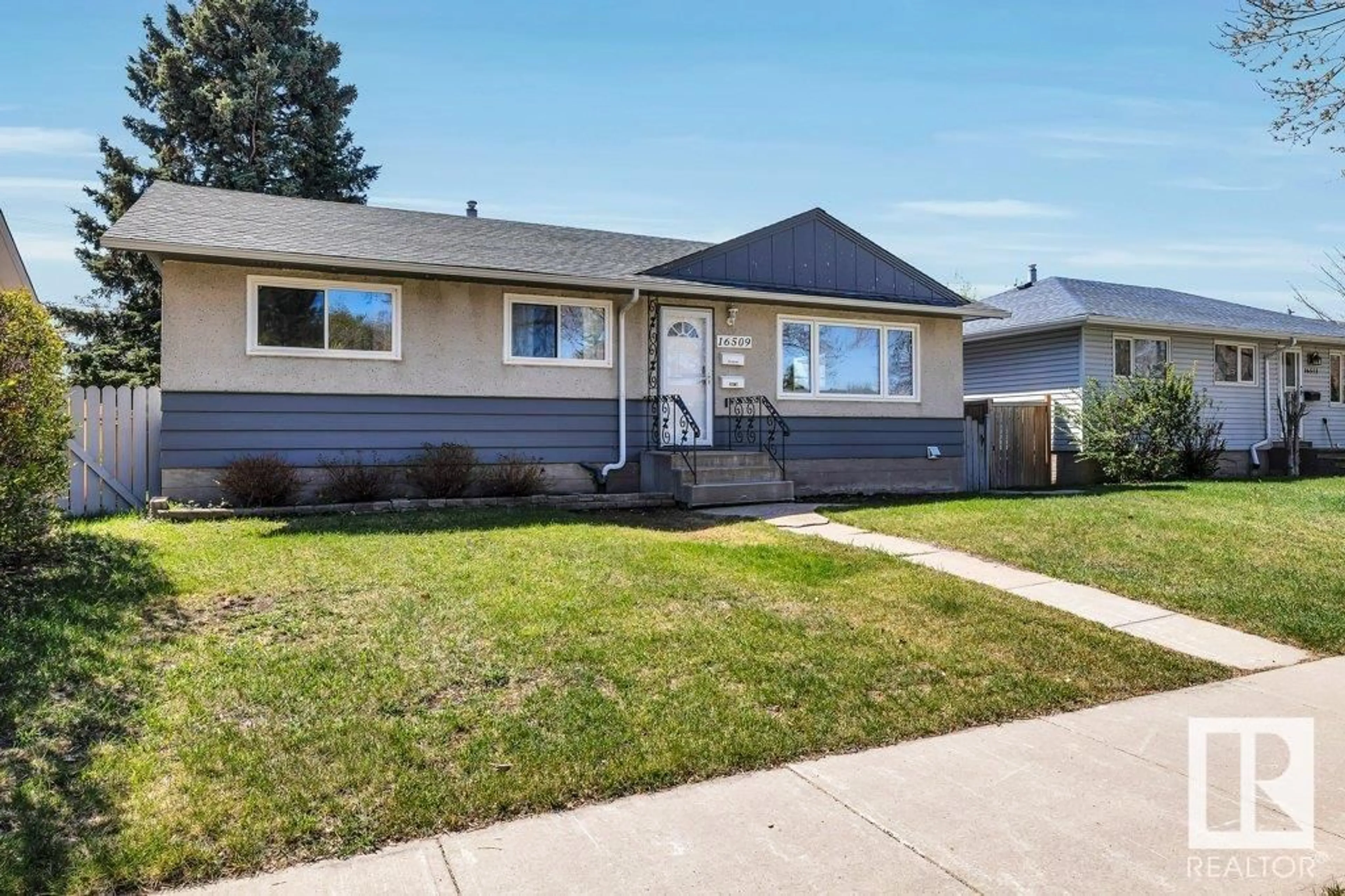 Home with vinyl exterior material, street for 16509 103 AV, Edmonton Alberta T5P0R1