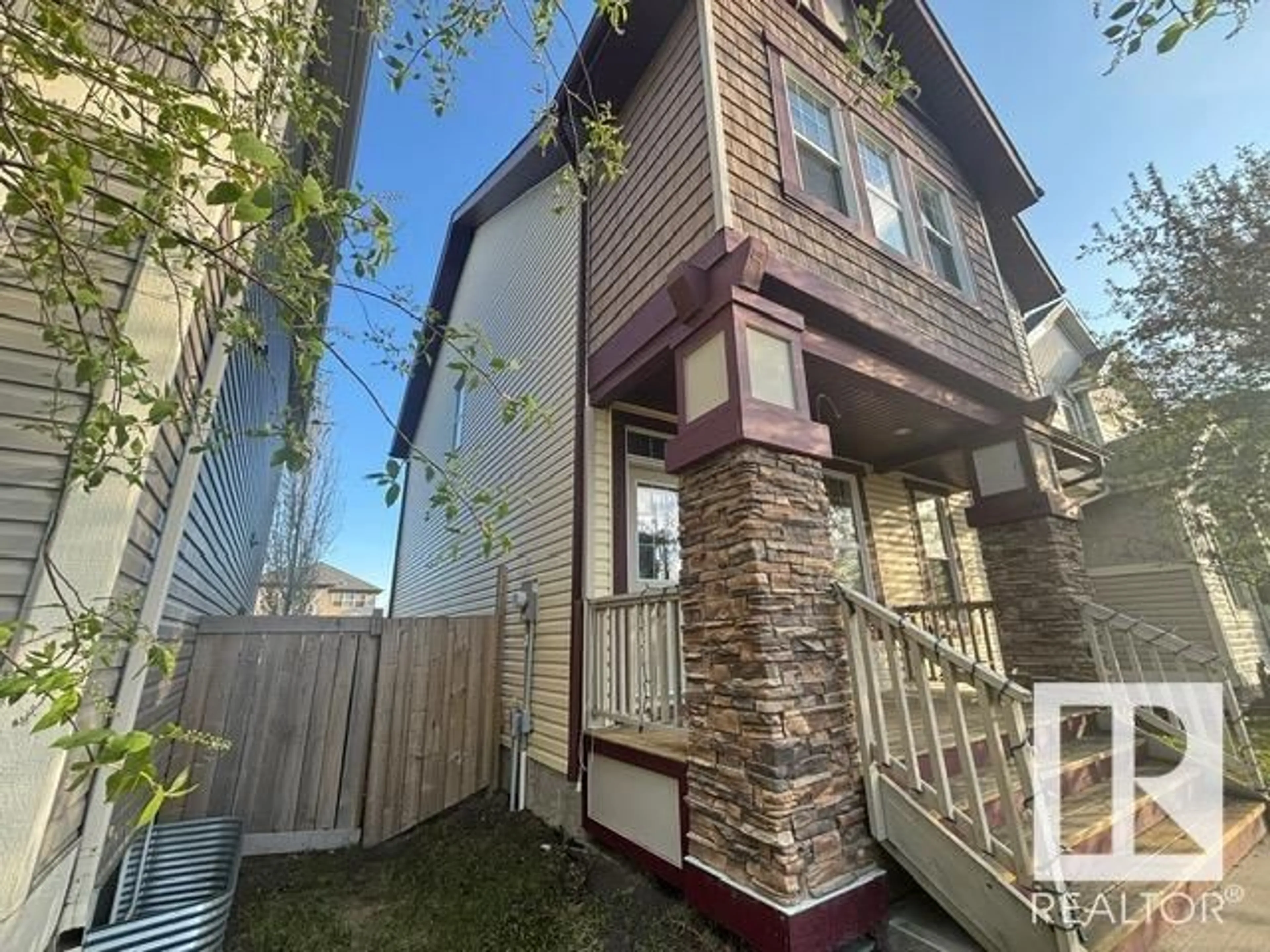 Home with vinyl exterior material, street for 1065 MCCONACHIE BV, Edmonton Alberta T5Y0P7