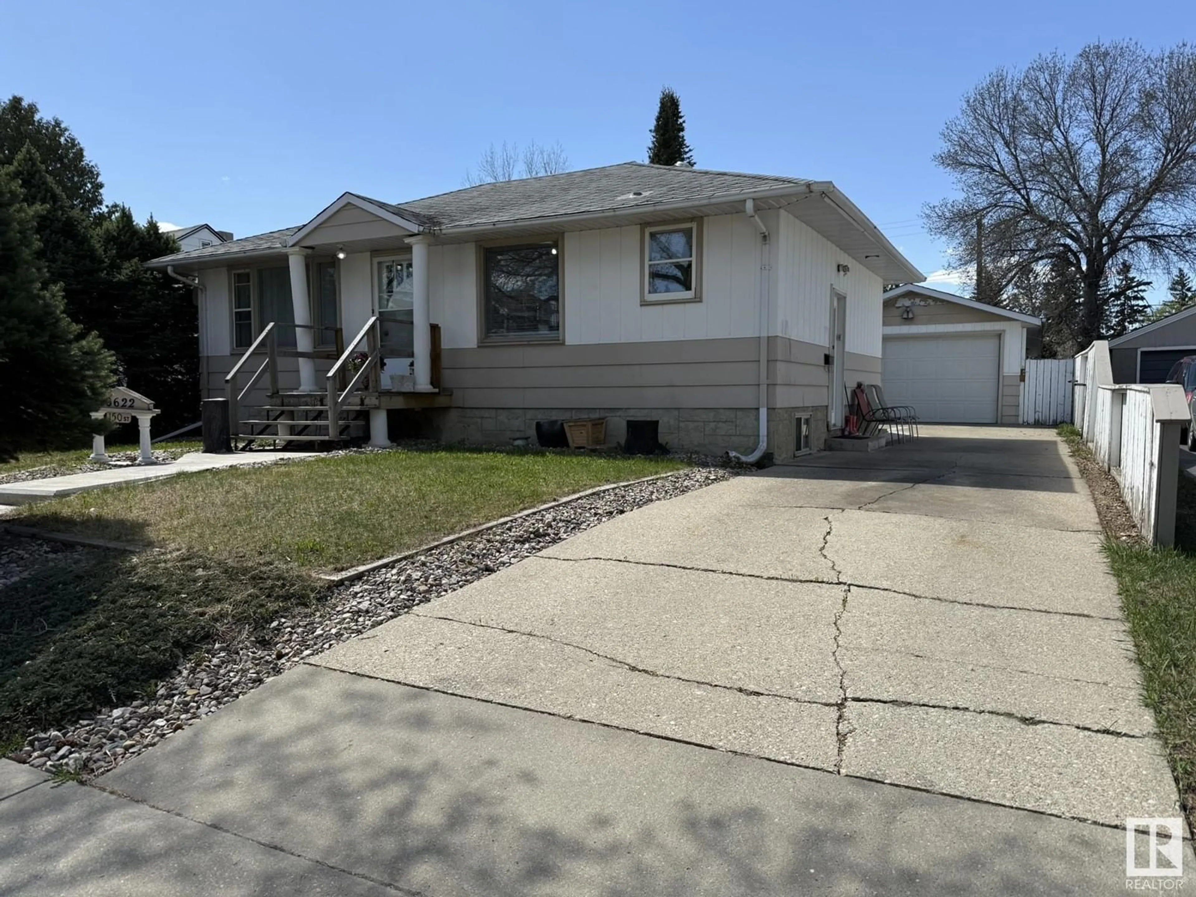 Home with vinyl exterior material, street for 10622 150 ST, Edmonton Alberta T5P1R2