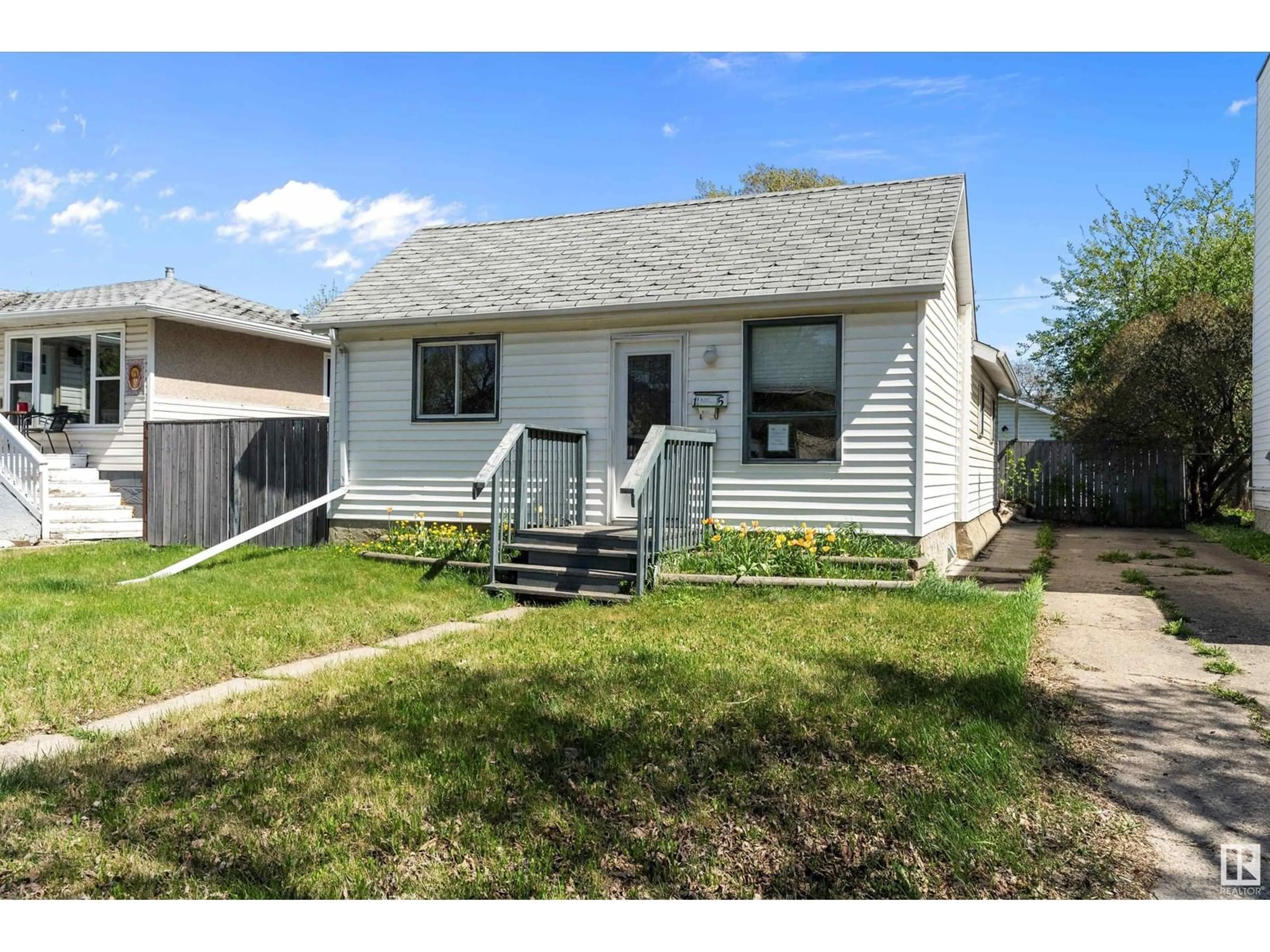 Home with vinyl exterior material, street for 12325 85 ST, Edmonton Alberta T5B3H1