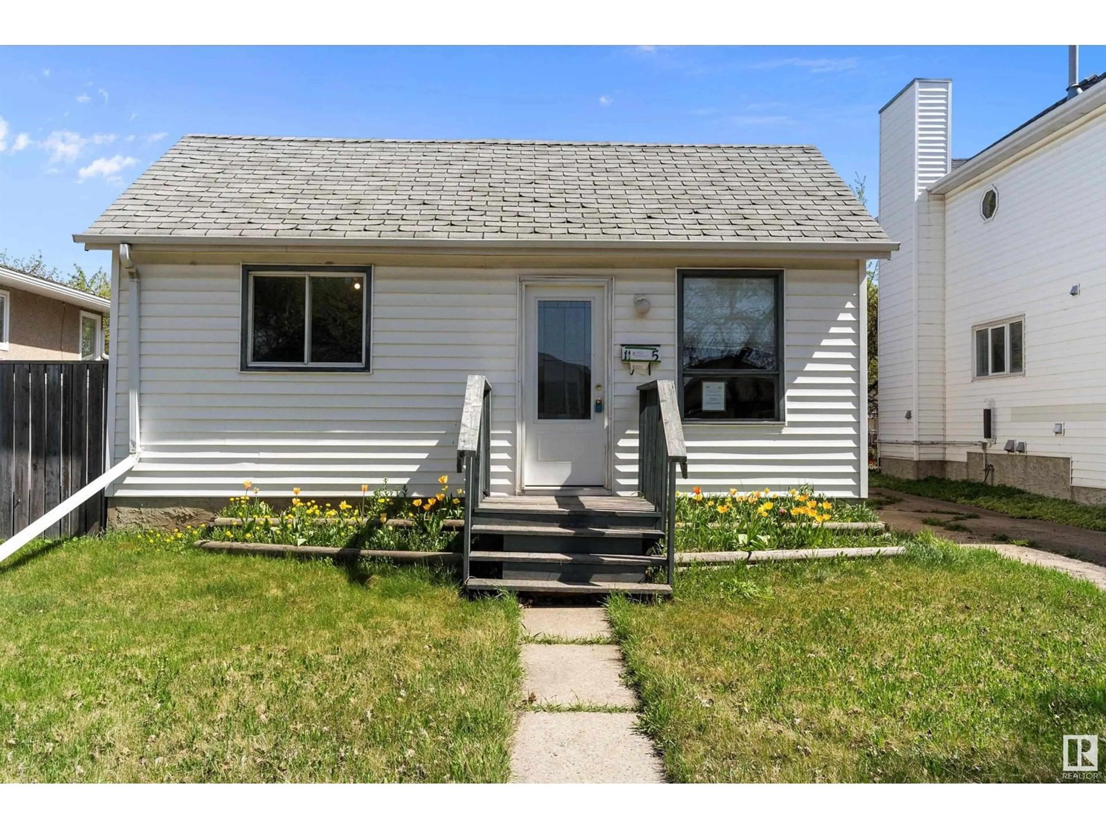 Home with vinyl exterior material, street for 12325 85 ST, Edmonton Alberta T5B3H1