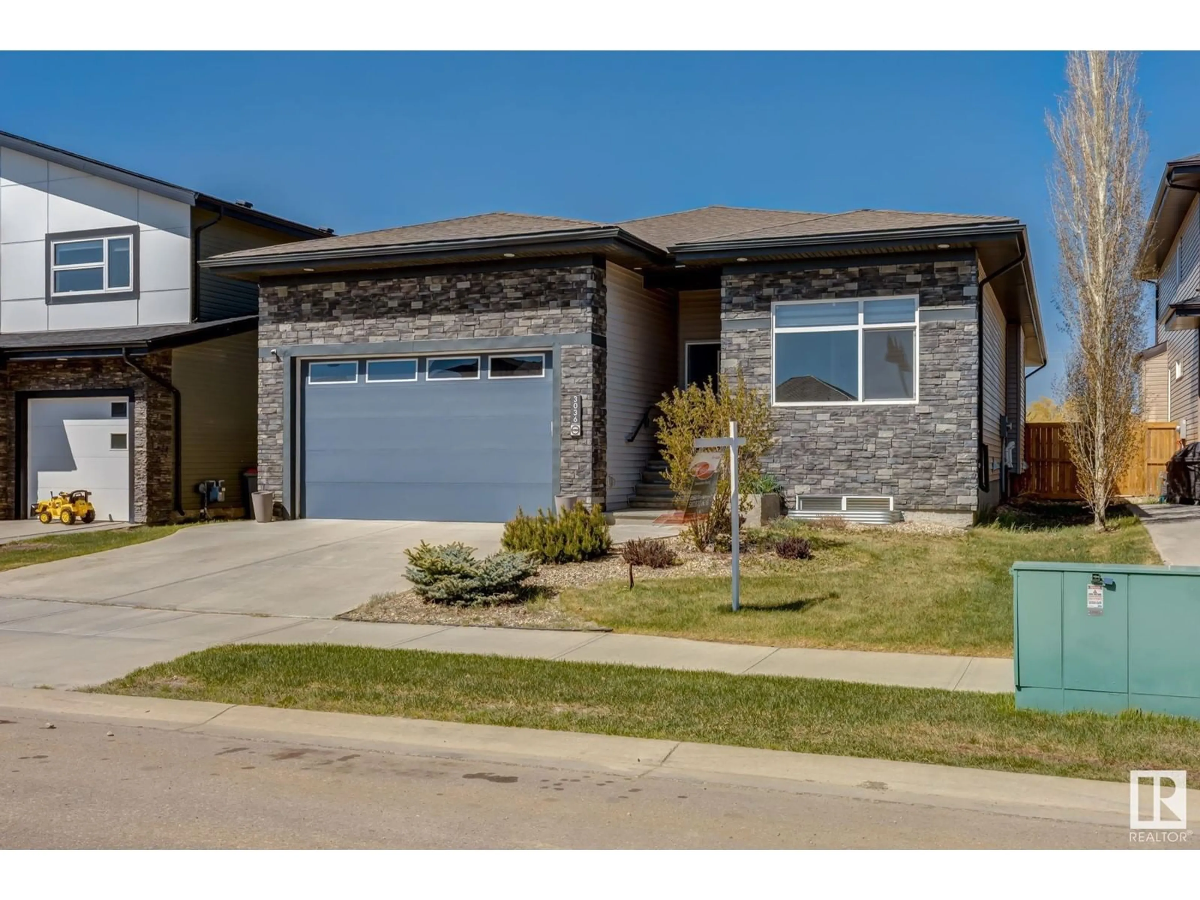 Home with brick exterior material, street for 3036 58 AVE, Rural Leduc County Alberta T4X0X9