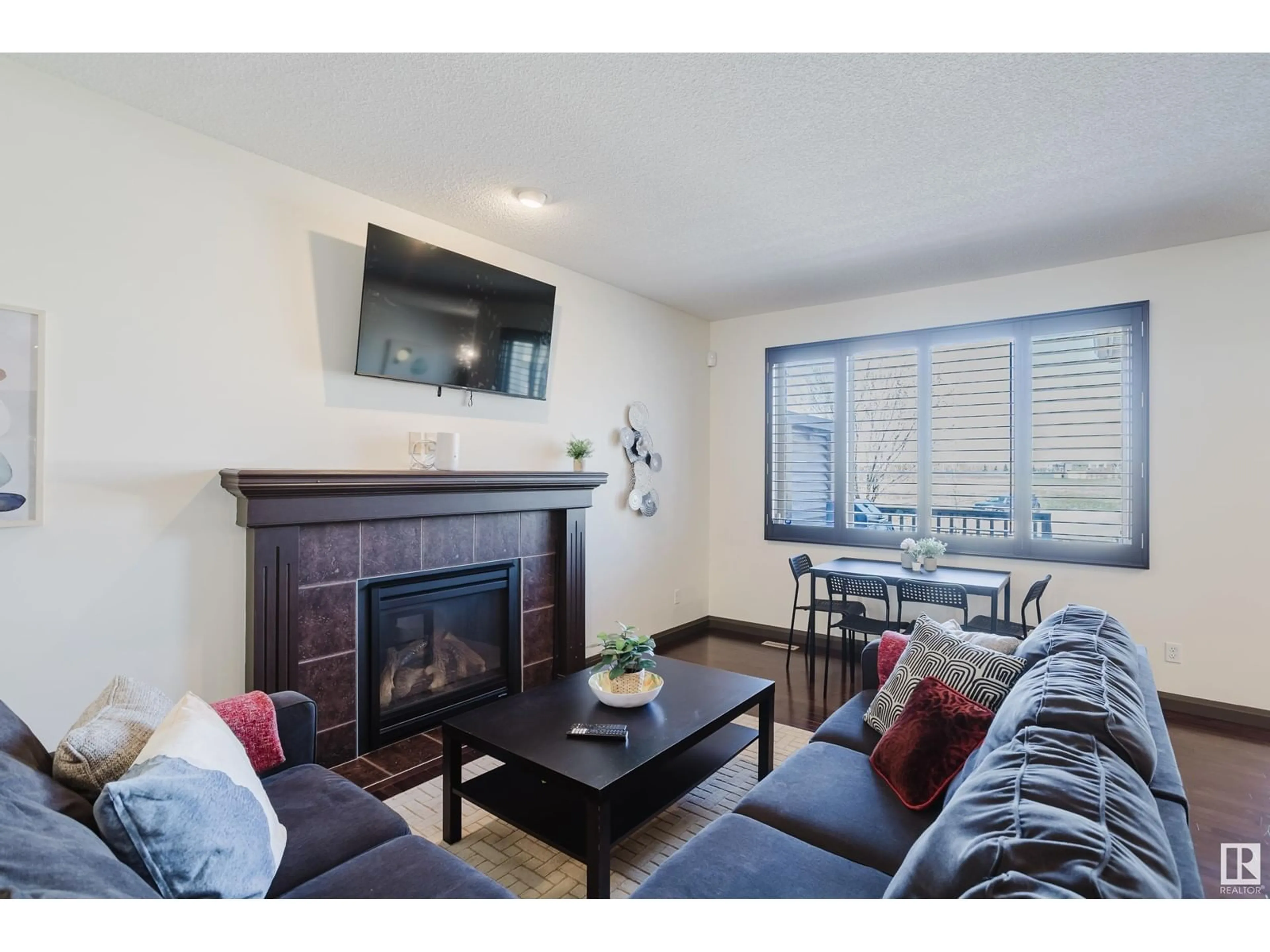 Living room with furniture, wood/laminate floor for 518 ADAMS WY, Edmonton Alberta T6W0H1