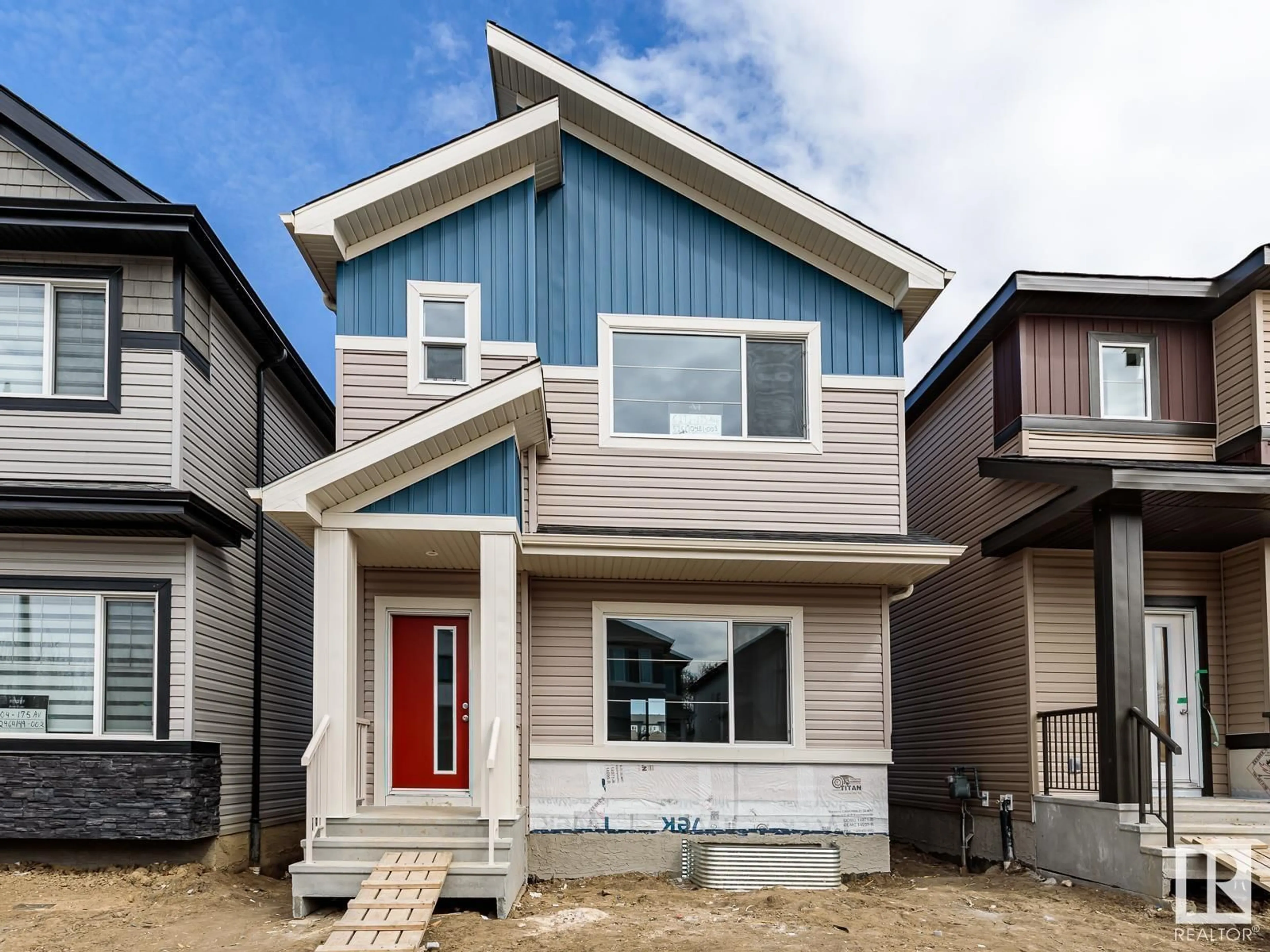 Home with vinyl exterior material, street for 6272 175 AV, Edmonton Alberta T5Y4H3