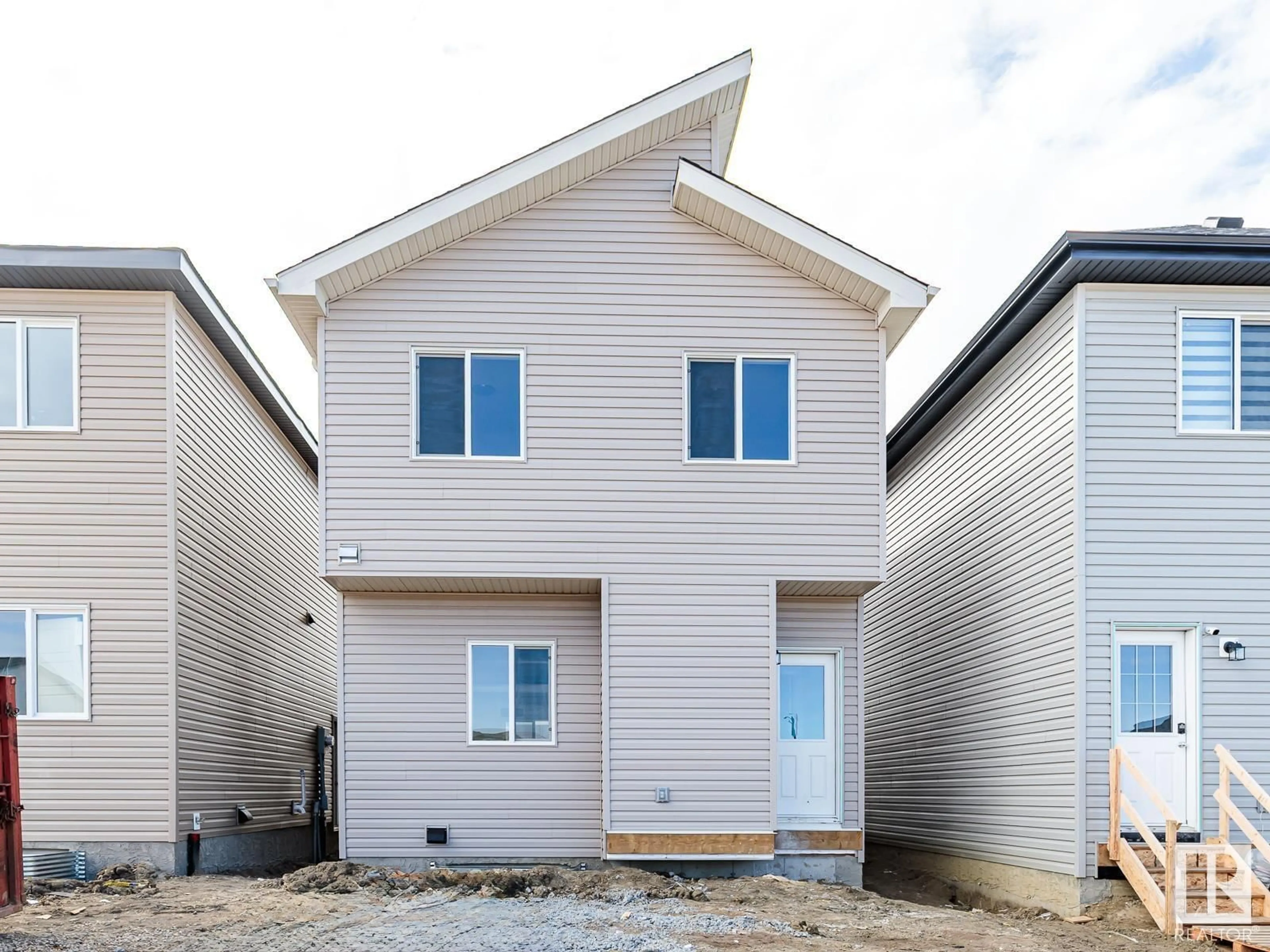 Home with vinyl exterior material, street for 6272 175 AV, Edmonton Alberta T5Y4H3
