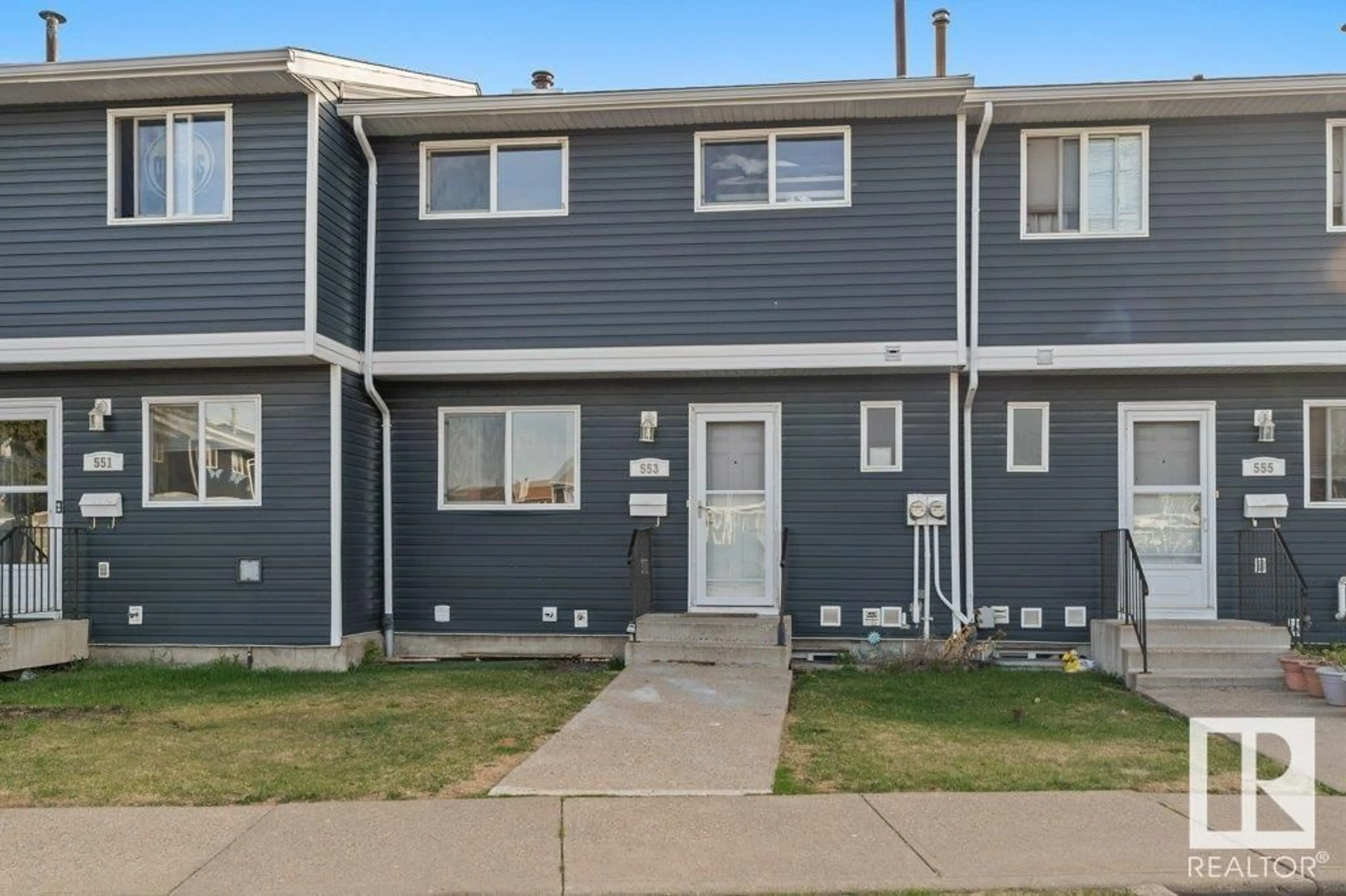 Home with vinyl exterior material, street for 553 DUNLUCE RD, Edmonton Alberta T5X4P4