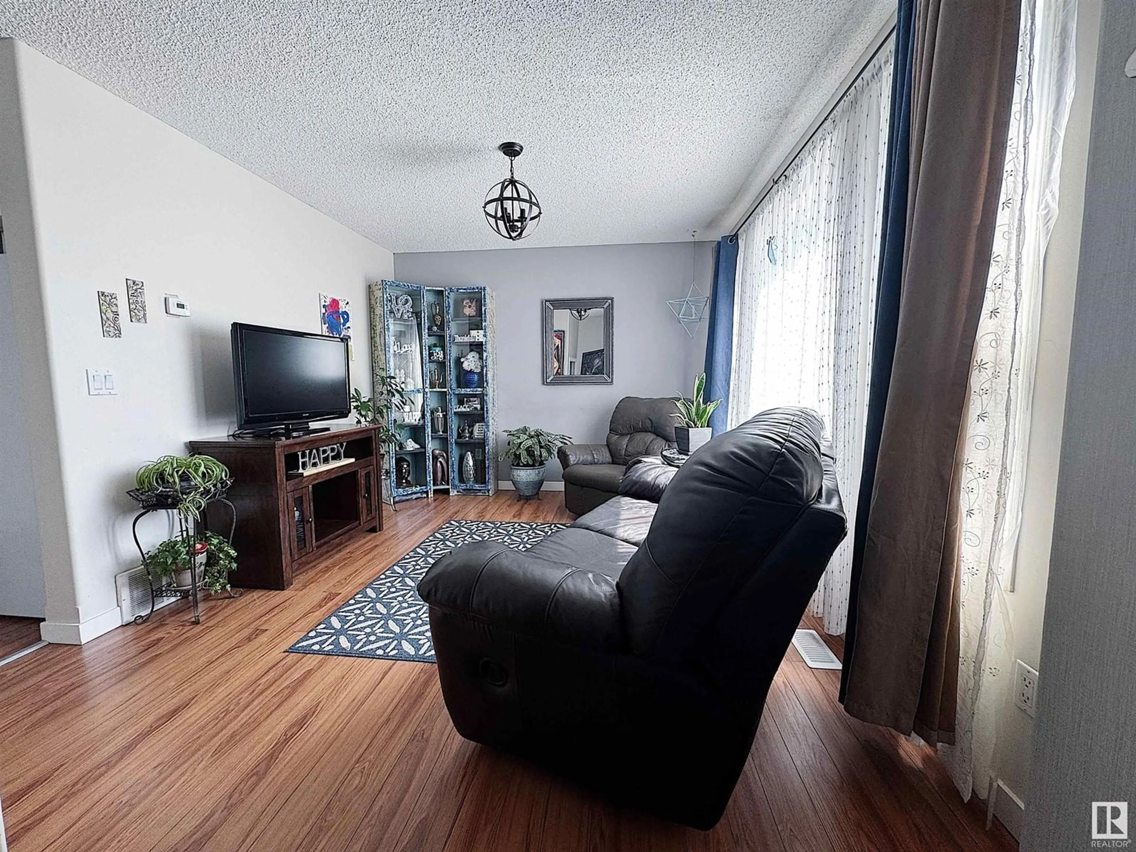 Living room with furniture, unknown for #9 - 16777 91 ST, Edmonton Alberta T5Z3X4
