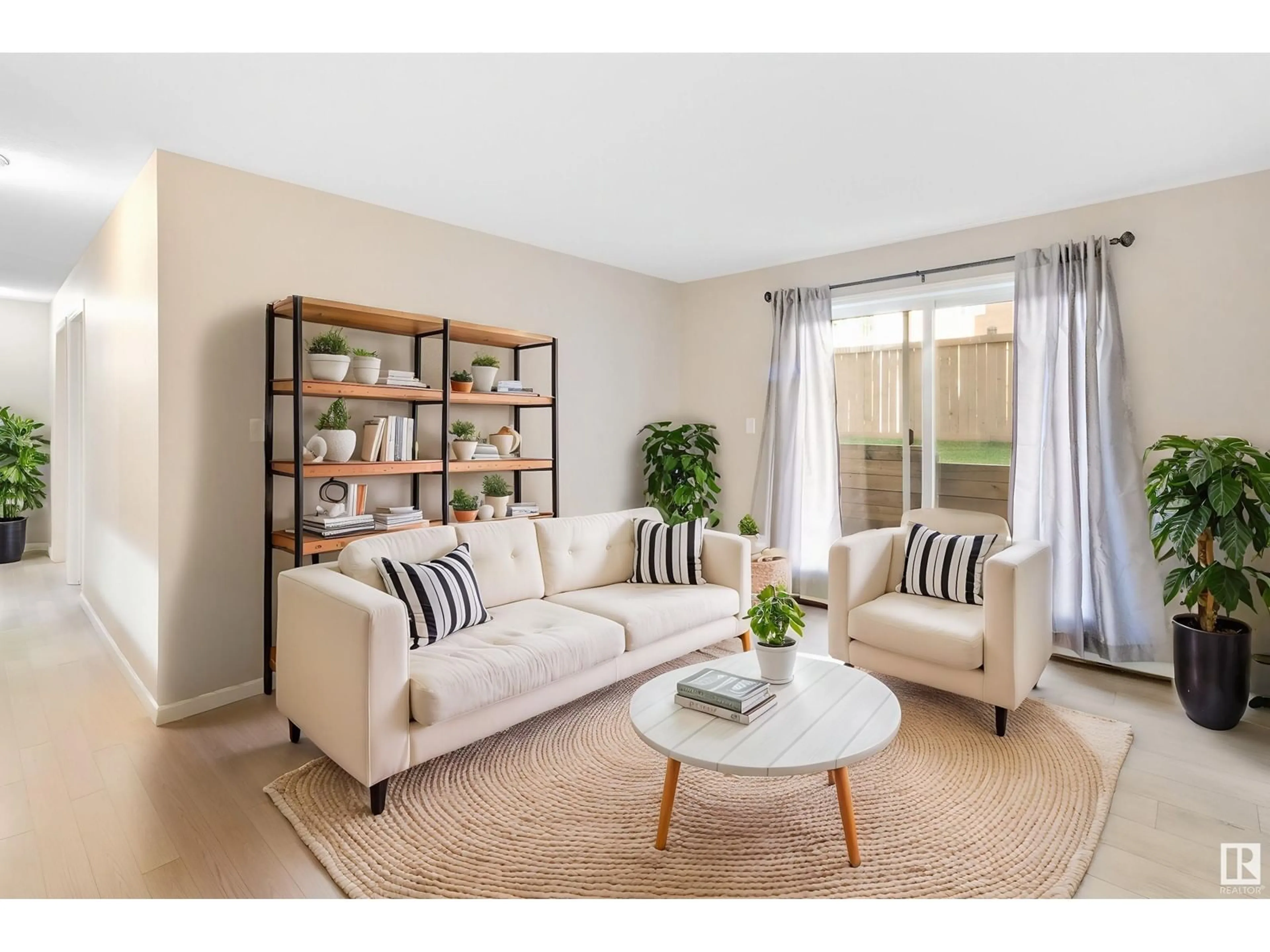 Living room with furniture, wood/laminate floor for 129 - 4210 139 AV, Edmonton Alberta T5Y2W6