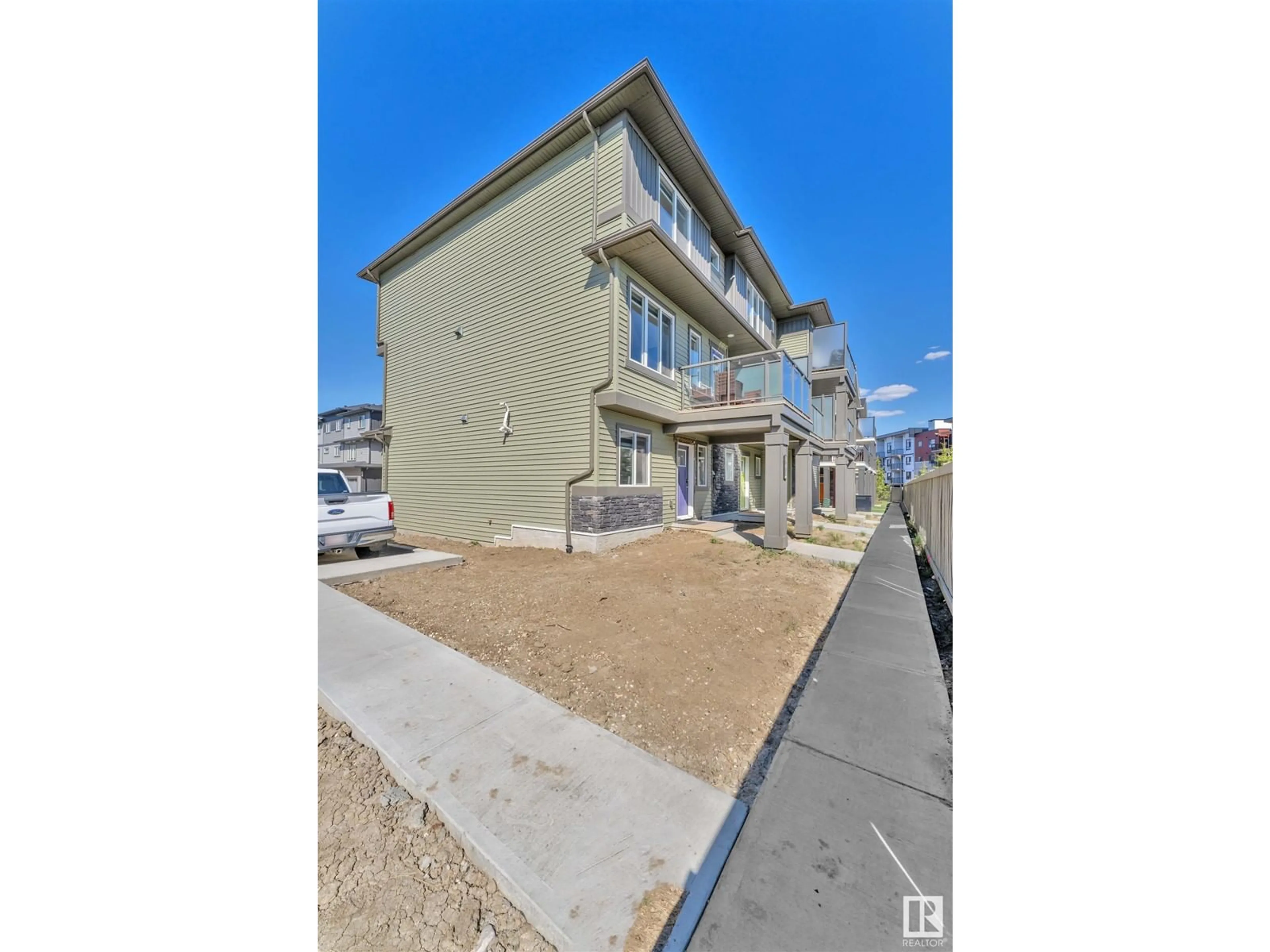 A pic from outside/outdoor area/front of a property/back of a property/a pic from drone, street for 1530 - 60A TAMARACK BLVD, Edmonton Alberta T6T2E6